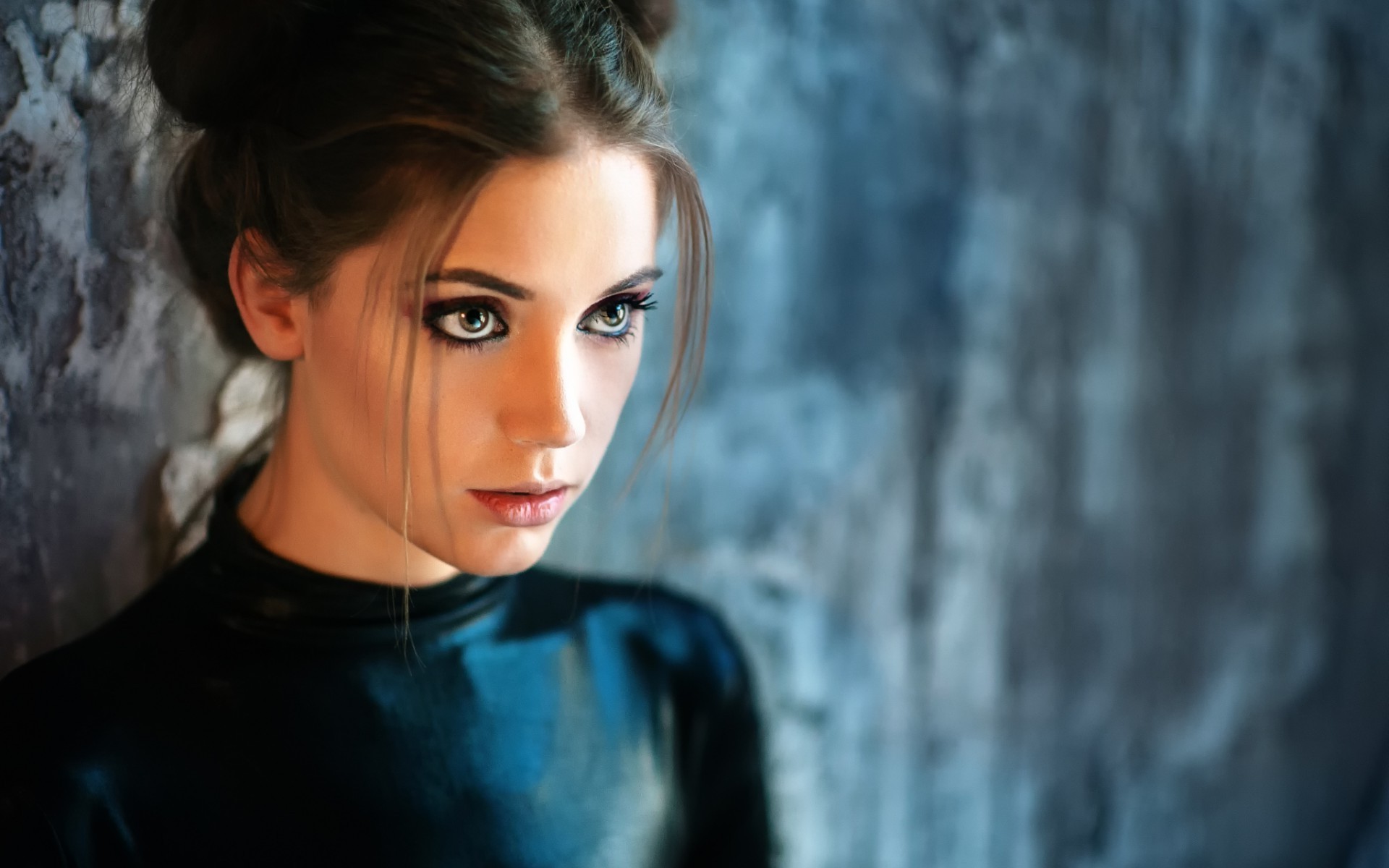 Woman with dark hair and dramatic makeup HD Wallpaper