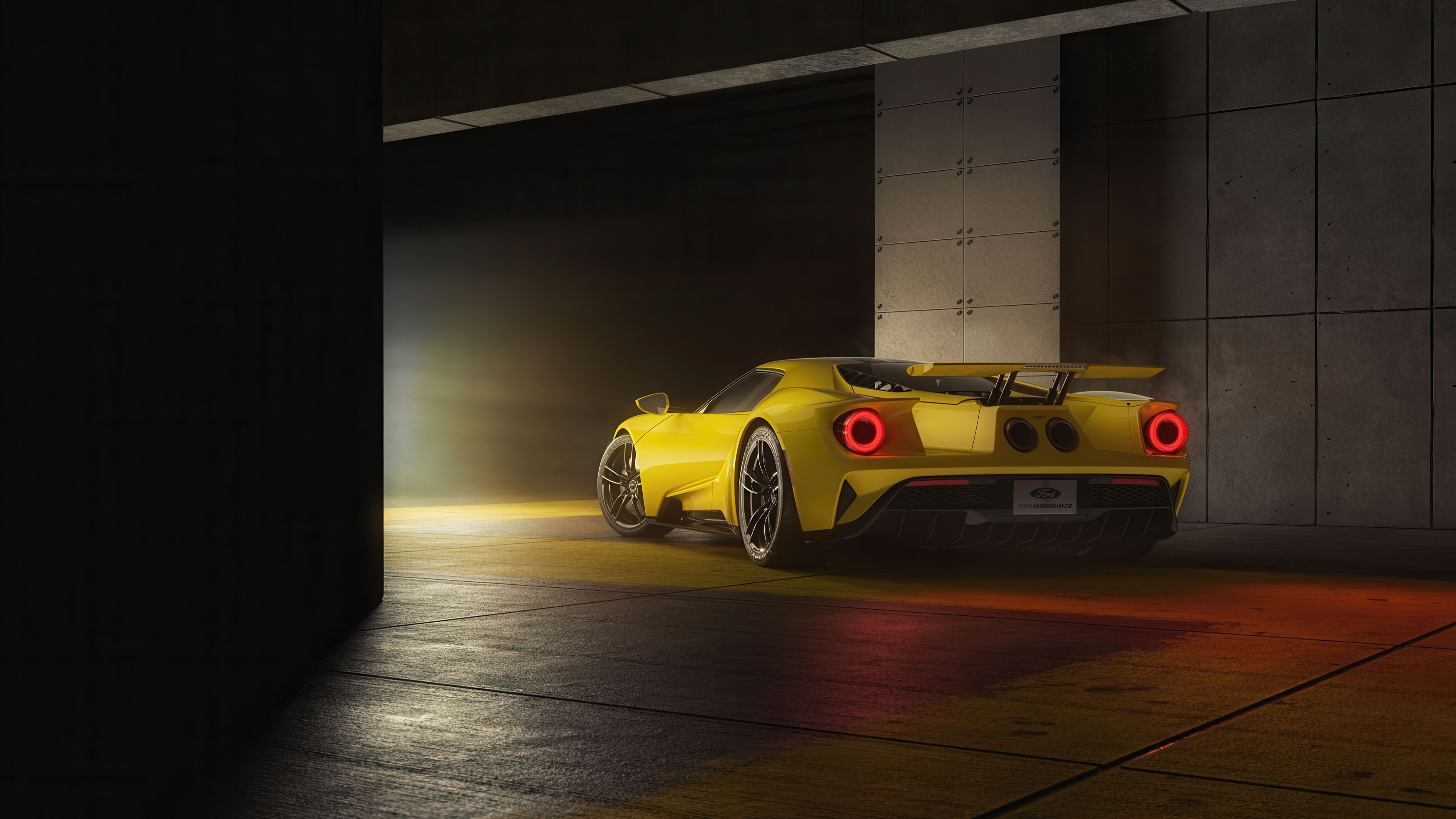Yellow Ford GT 2024 in a dark garage HD Wallpaper