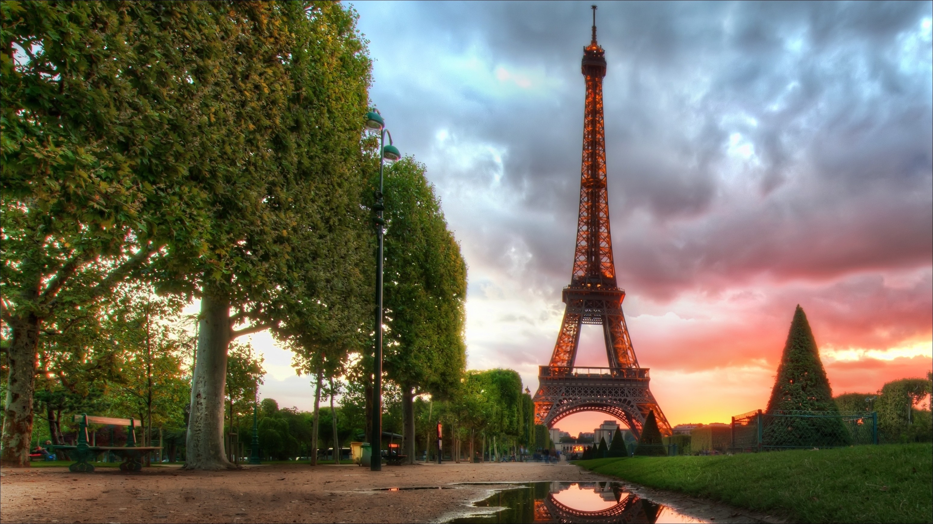 Eiffel Tower at sunset with trees and reflection HD Wallpaper