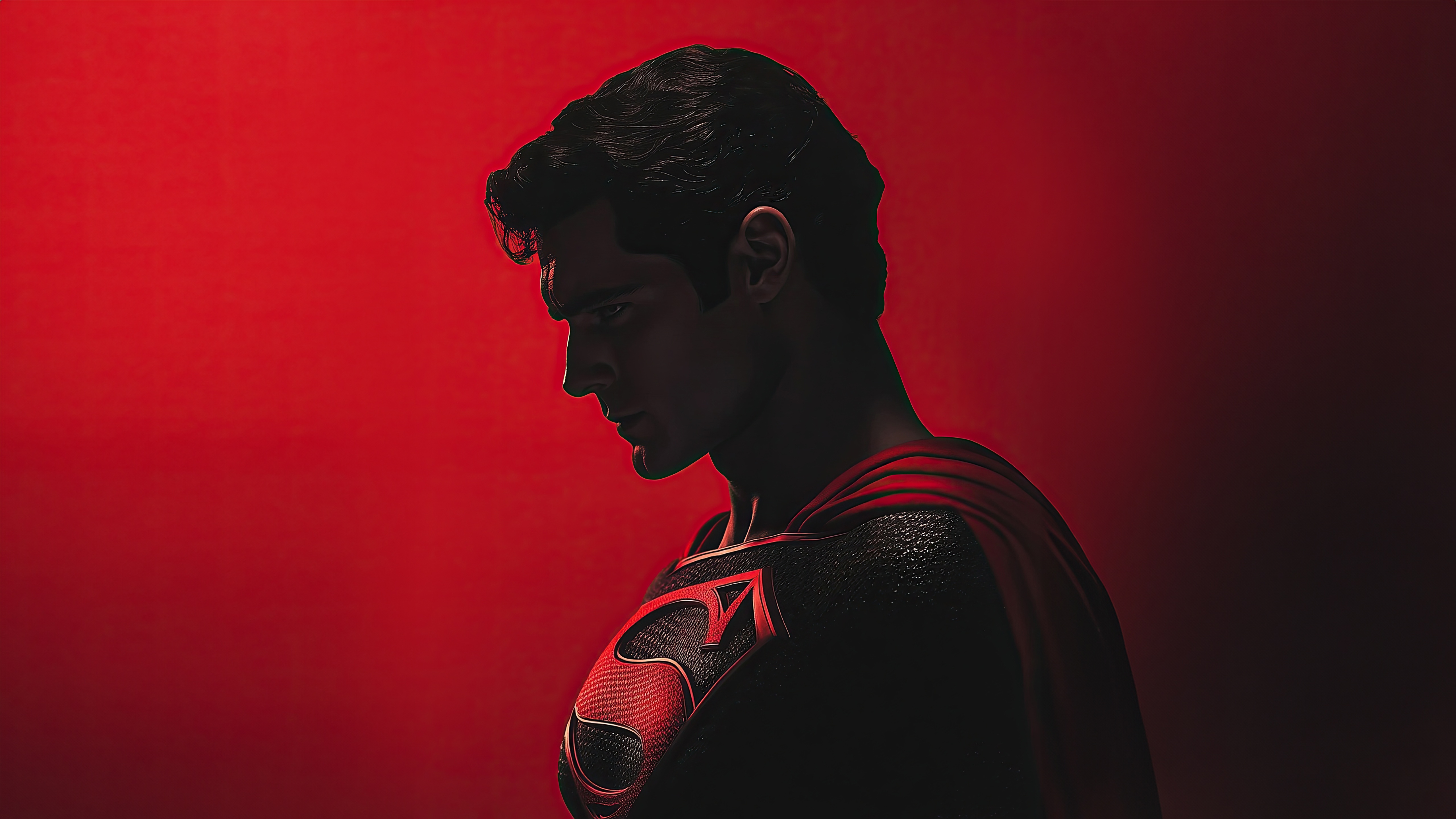 Superman in a red suit on a red background HD Wallpaper