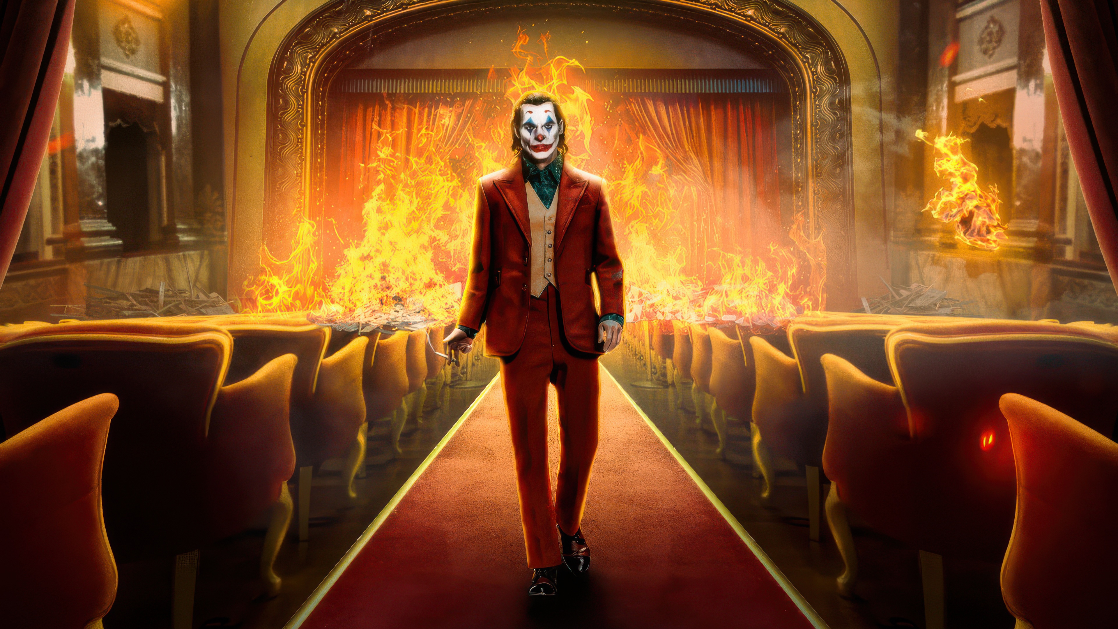 Joker walking through a burning theater HD Wallpaper