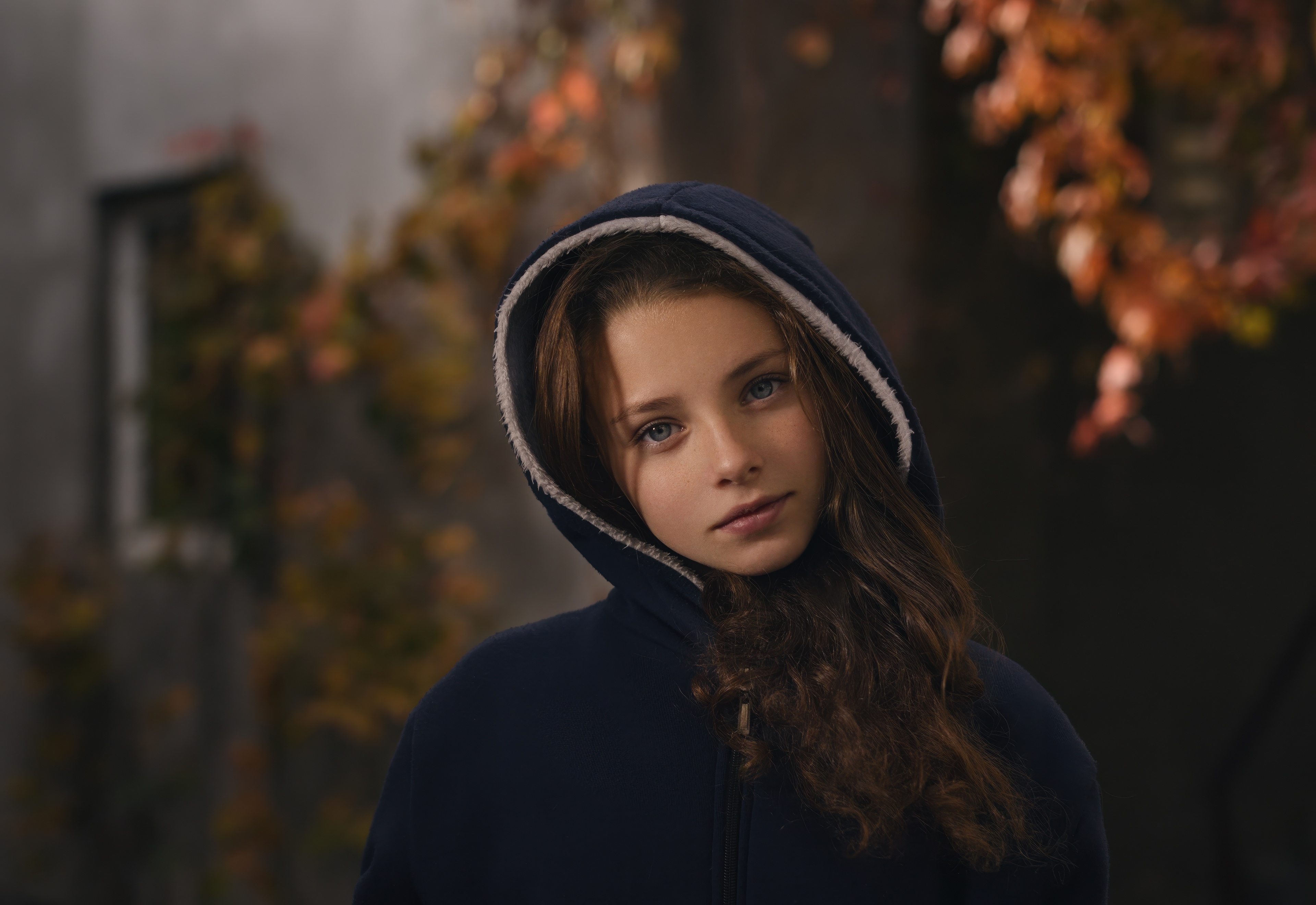 Girl in a blue hoodie with autumn leaves HD Wallpaper