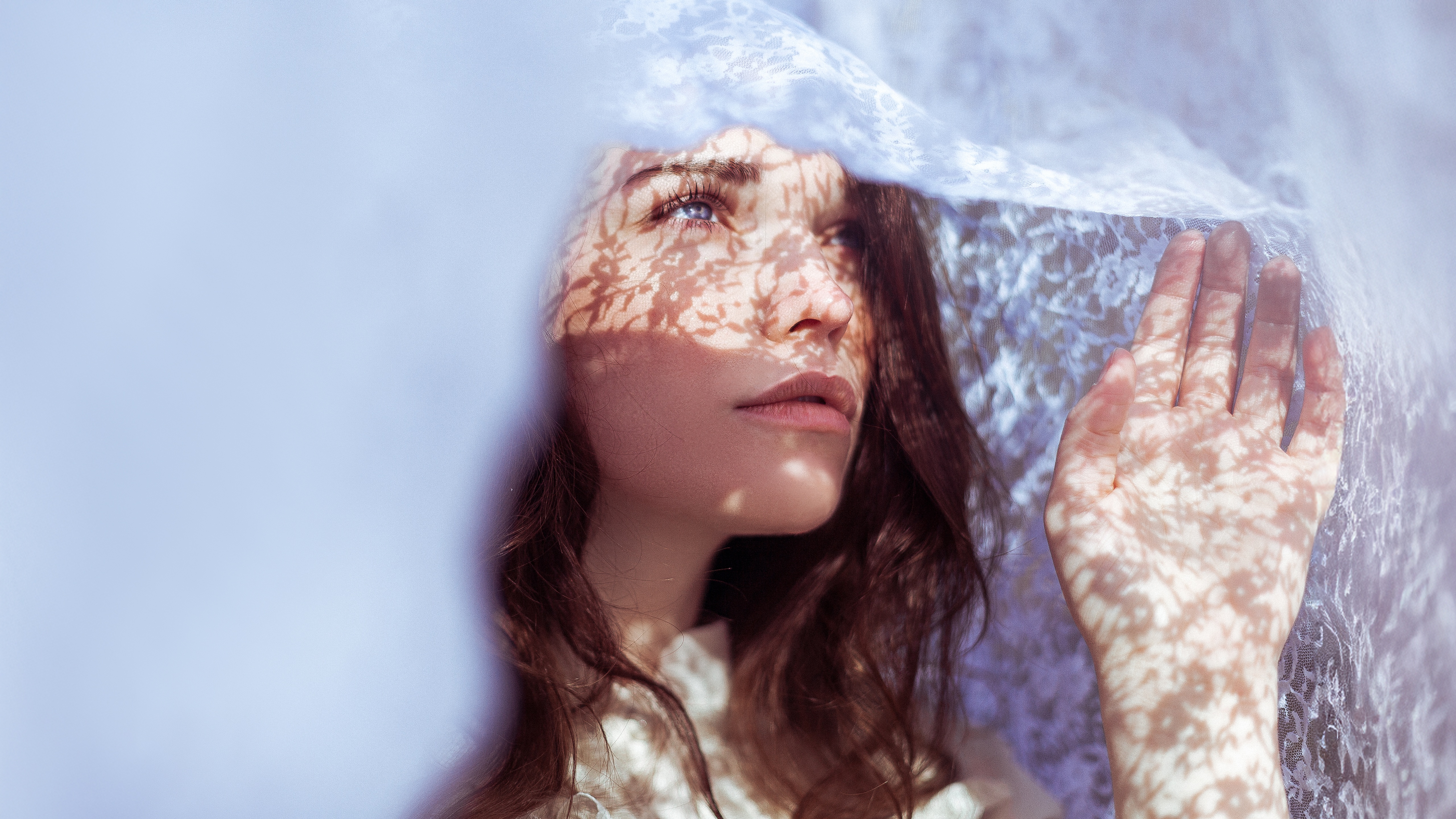 Woman with blue eyes behind lace HD Wallpaper