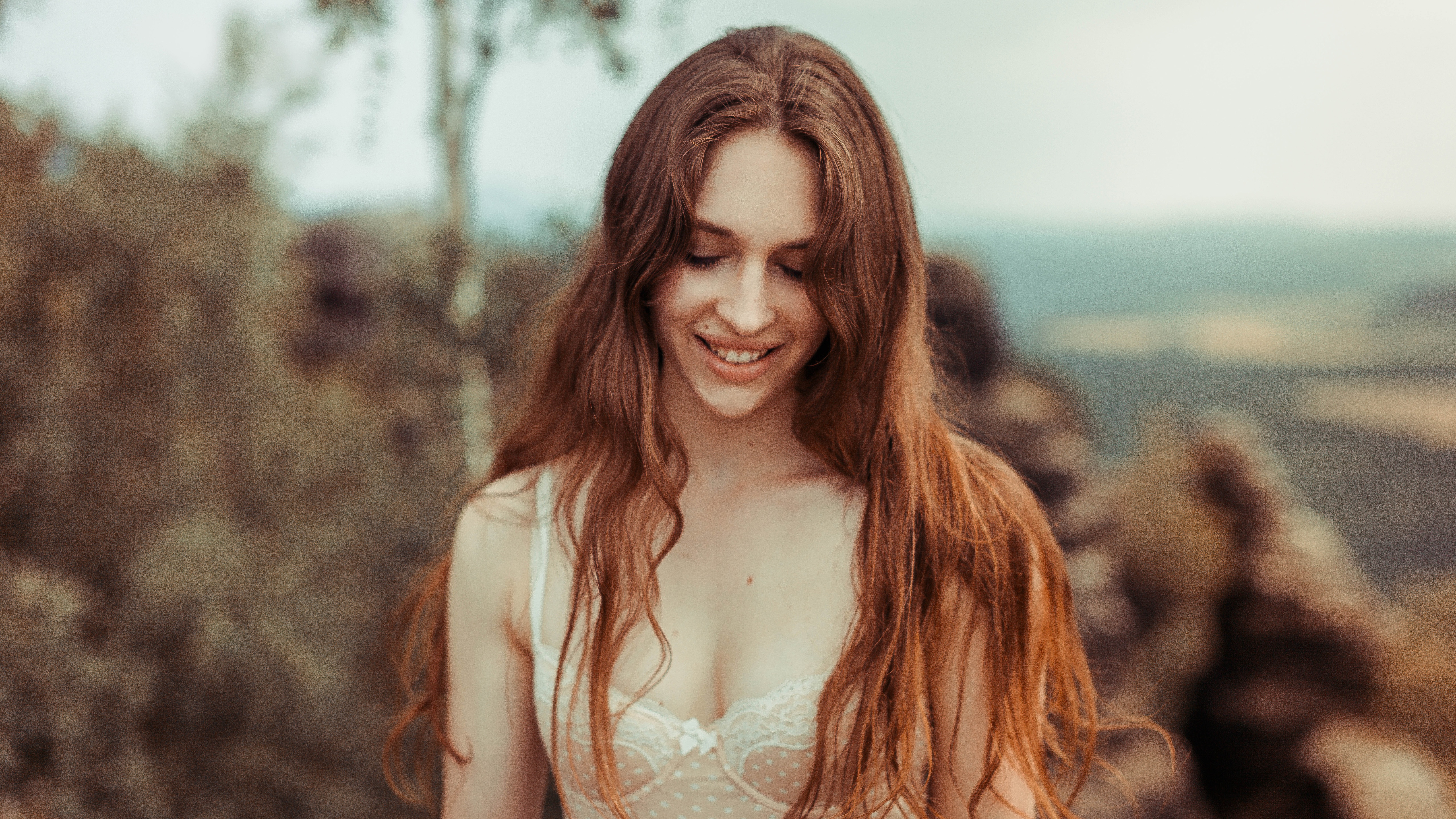 Woman in white lingerie smiling outdoors HD Wallpaper