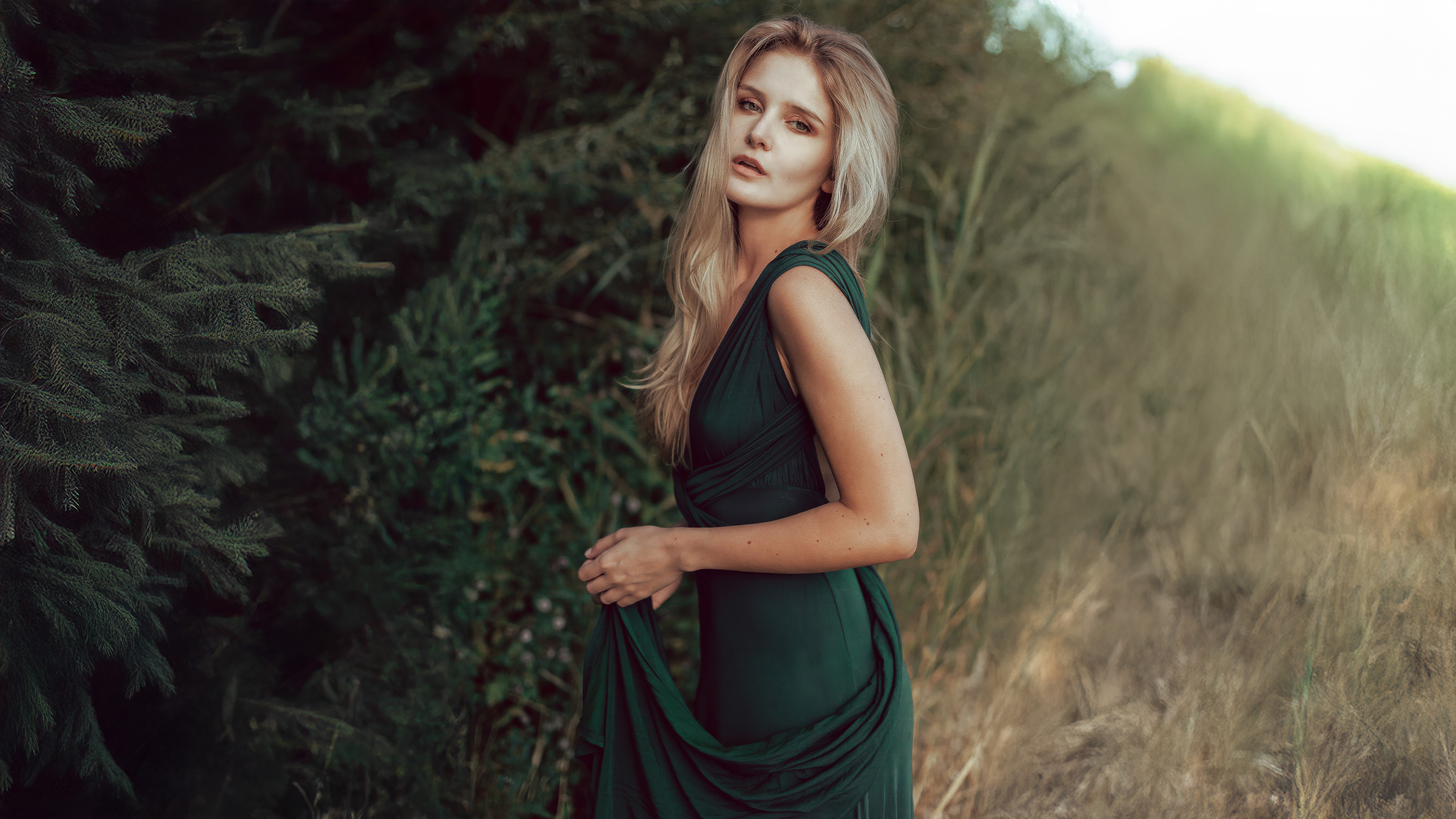 Woman in a green dress in the woods HD Wallpaper