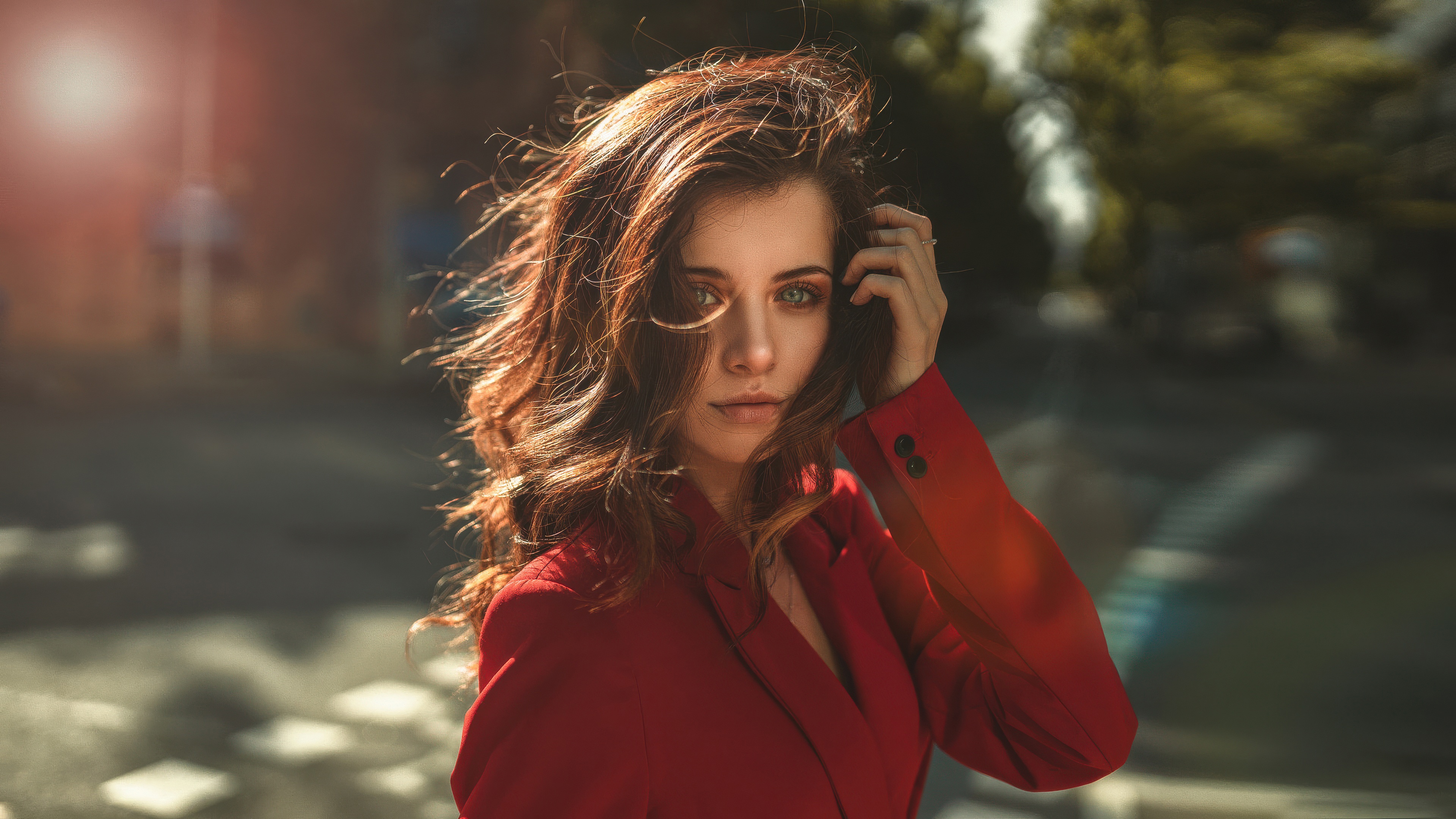 Woman in Red Adjusting Her Hair Outdoors HD Wallpaper
