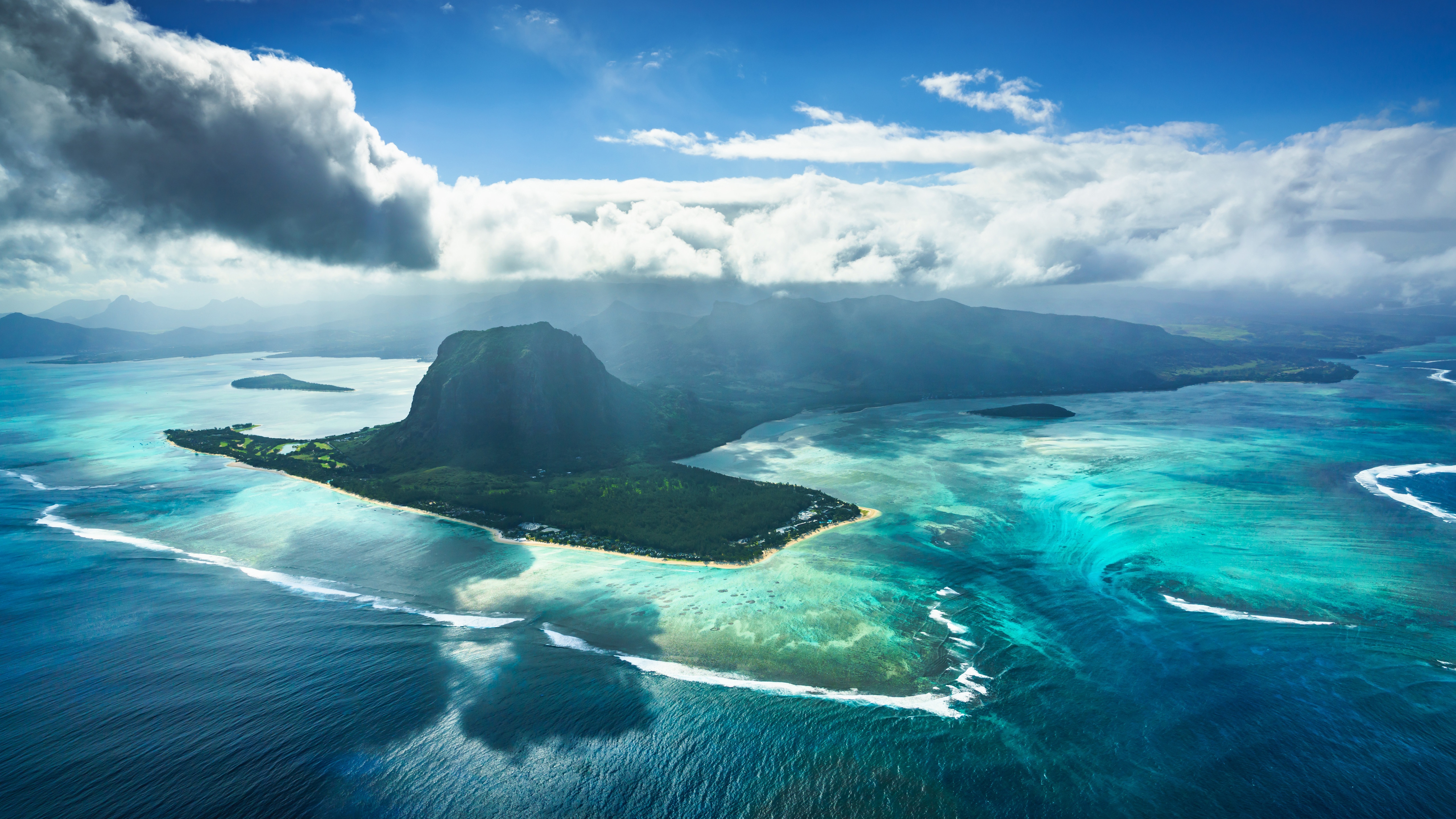 Aerial view of Le Morne Brabant mountain and turquoise waters HD Wallpaper