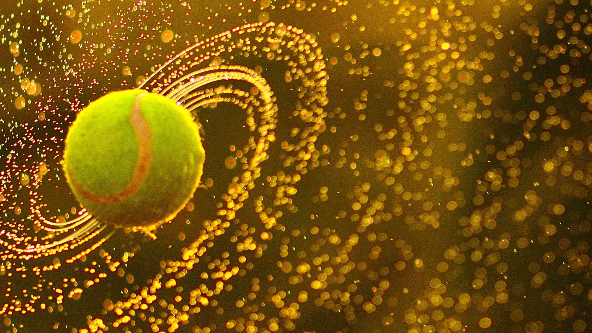 Tennis ball with water drops in motion HD Wallpaper