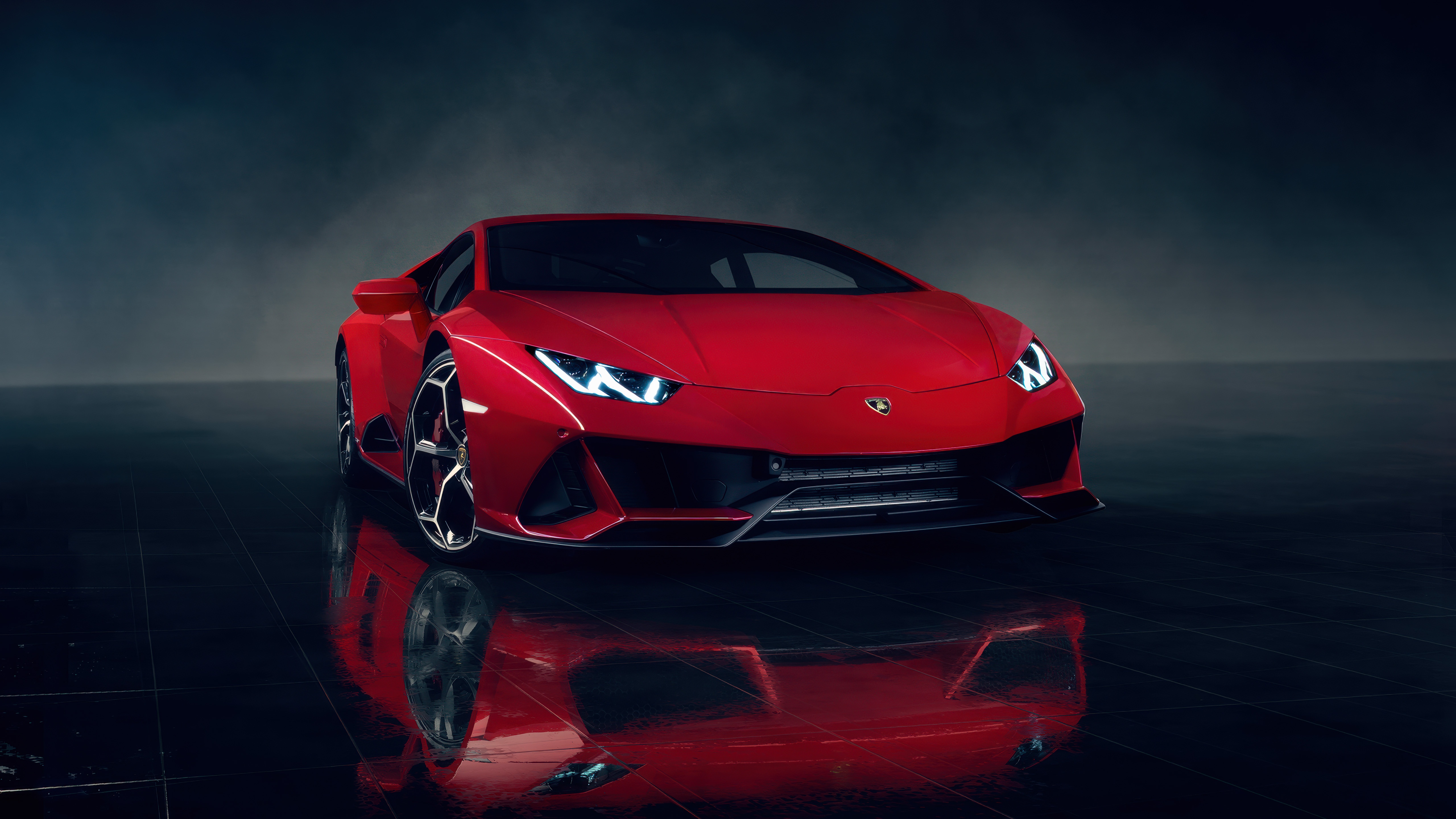 Red Lamborghini Huracan on a reflective surface HD Wallpaper