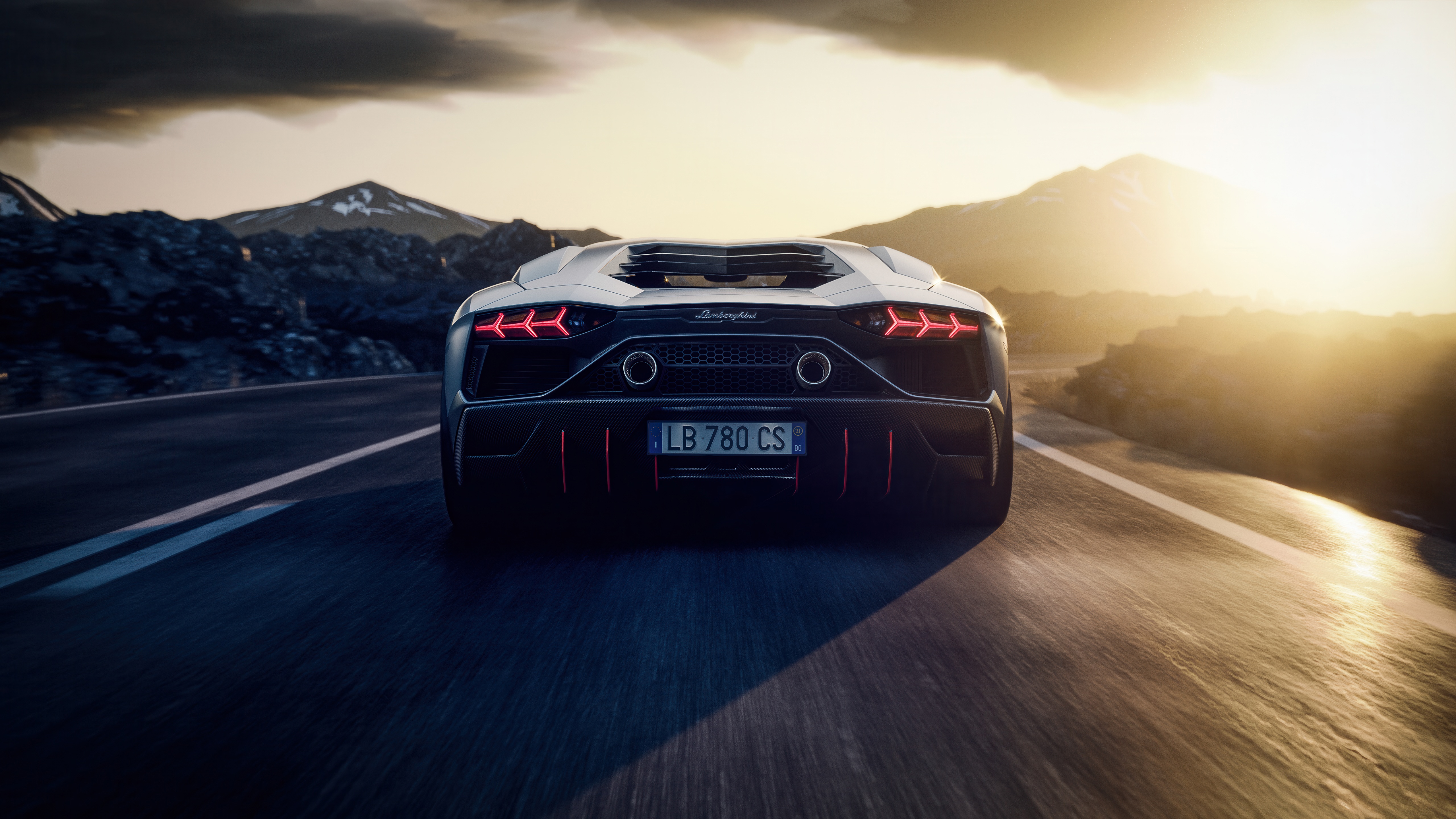 Lamborghini Aventador driving on a mountain road at sunset HD Wallpaper