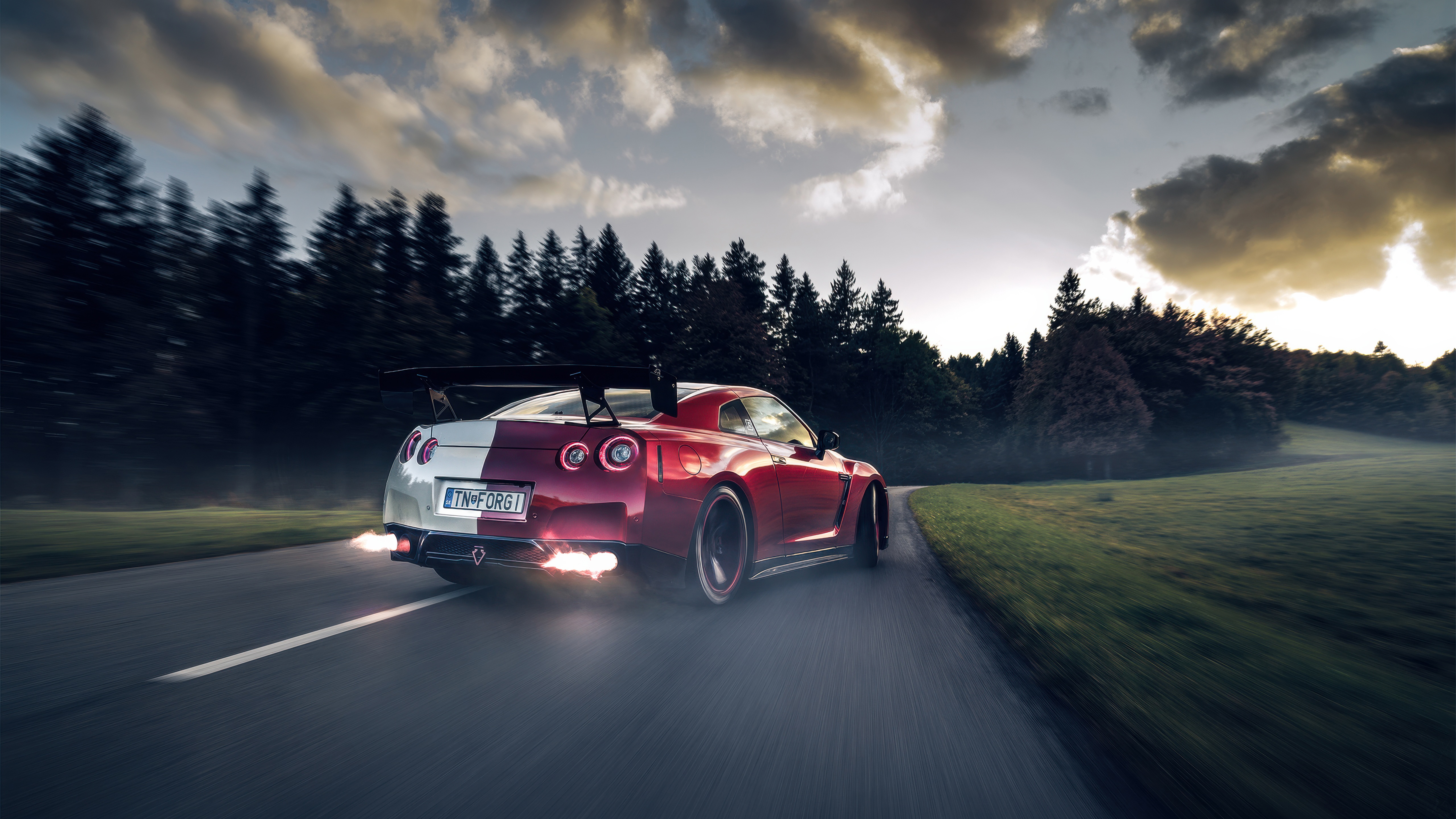 Nissan GTR with flames coming out of exhaust HD Wallpaper