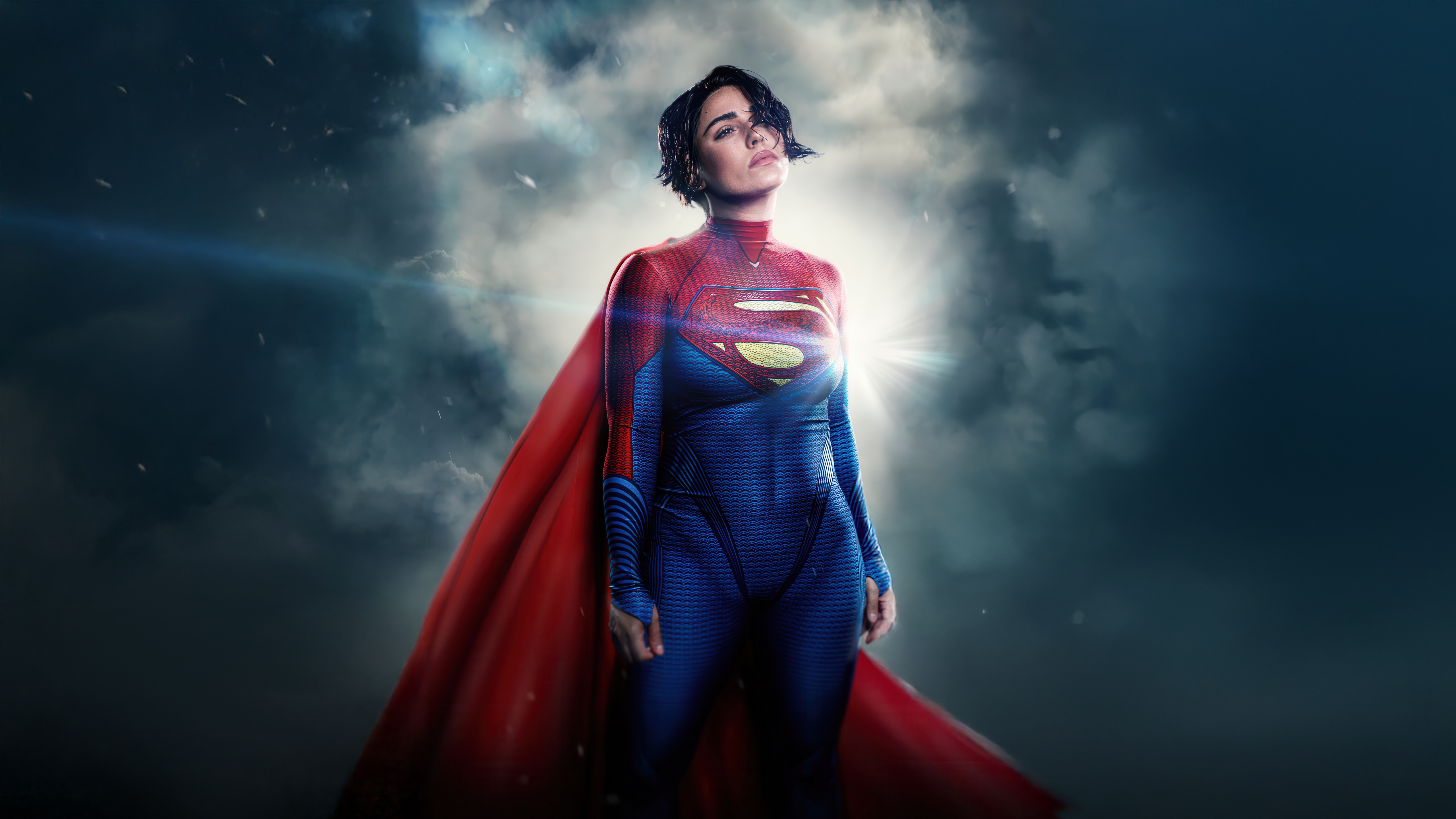Supergirl in a red and blue suit with a red cape HD Wallpaper