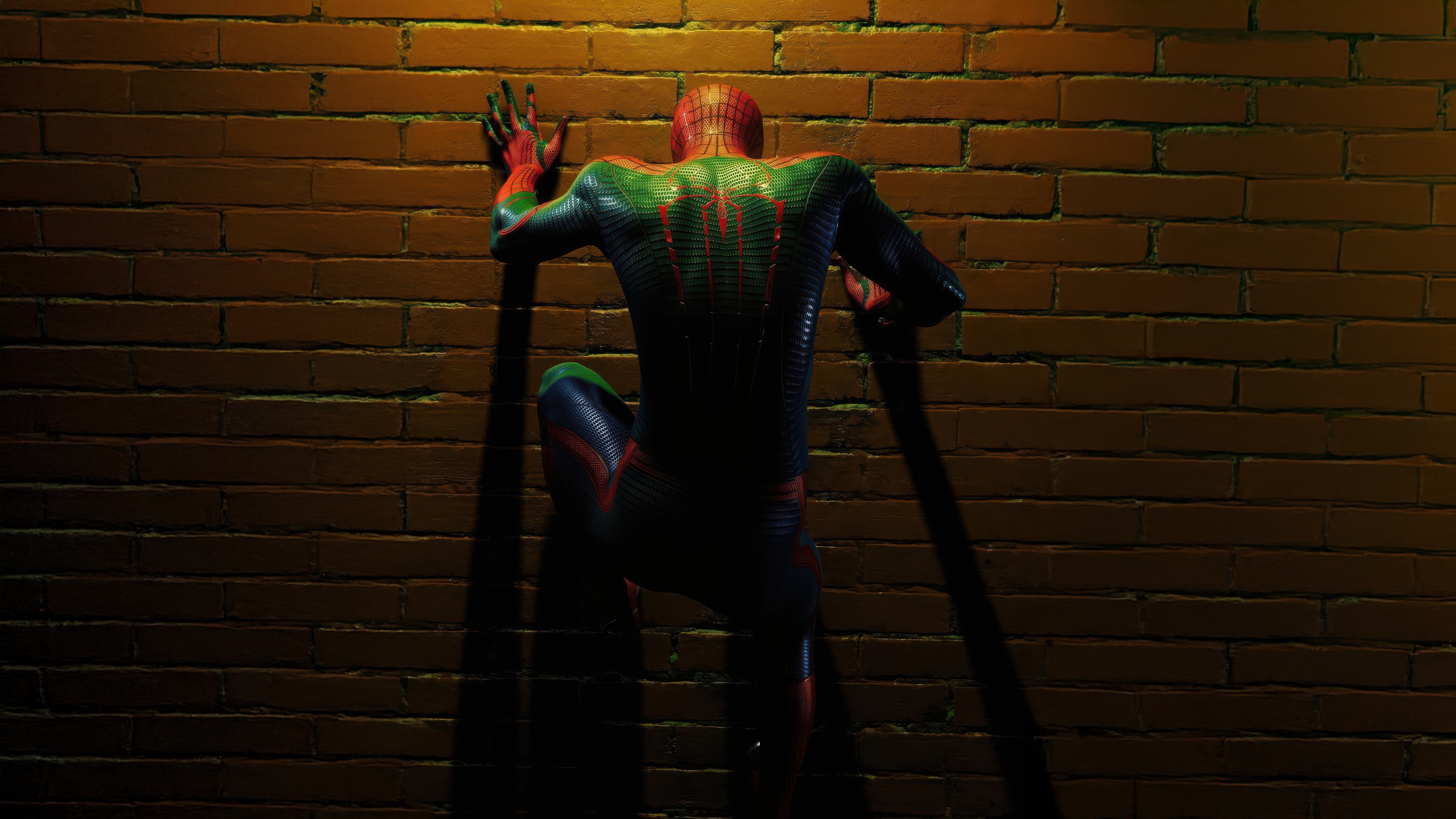 Spiderman climbing a brick wall at night HD Wallpaper