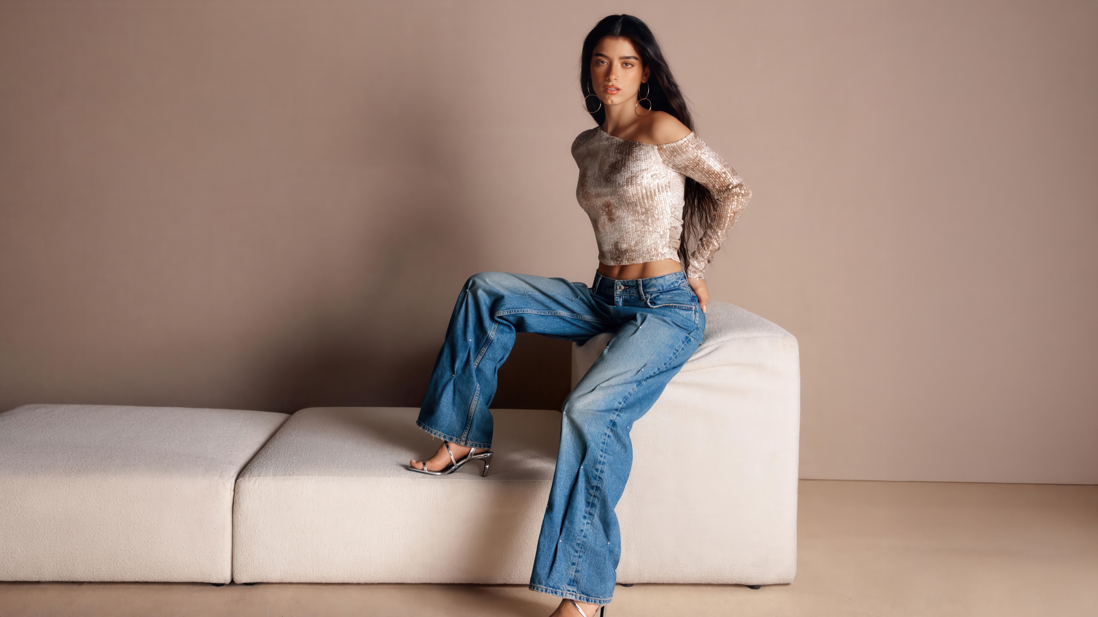 Dixie D Amelio Poses on a White Couch HD Wallpaper