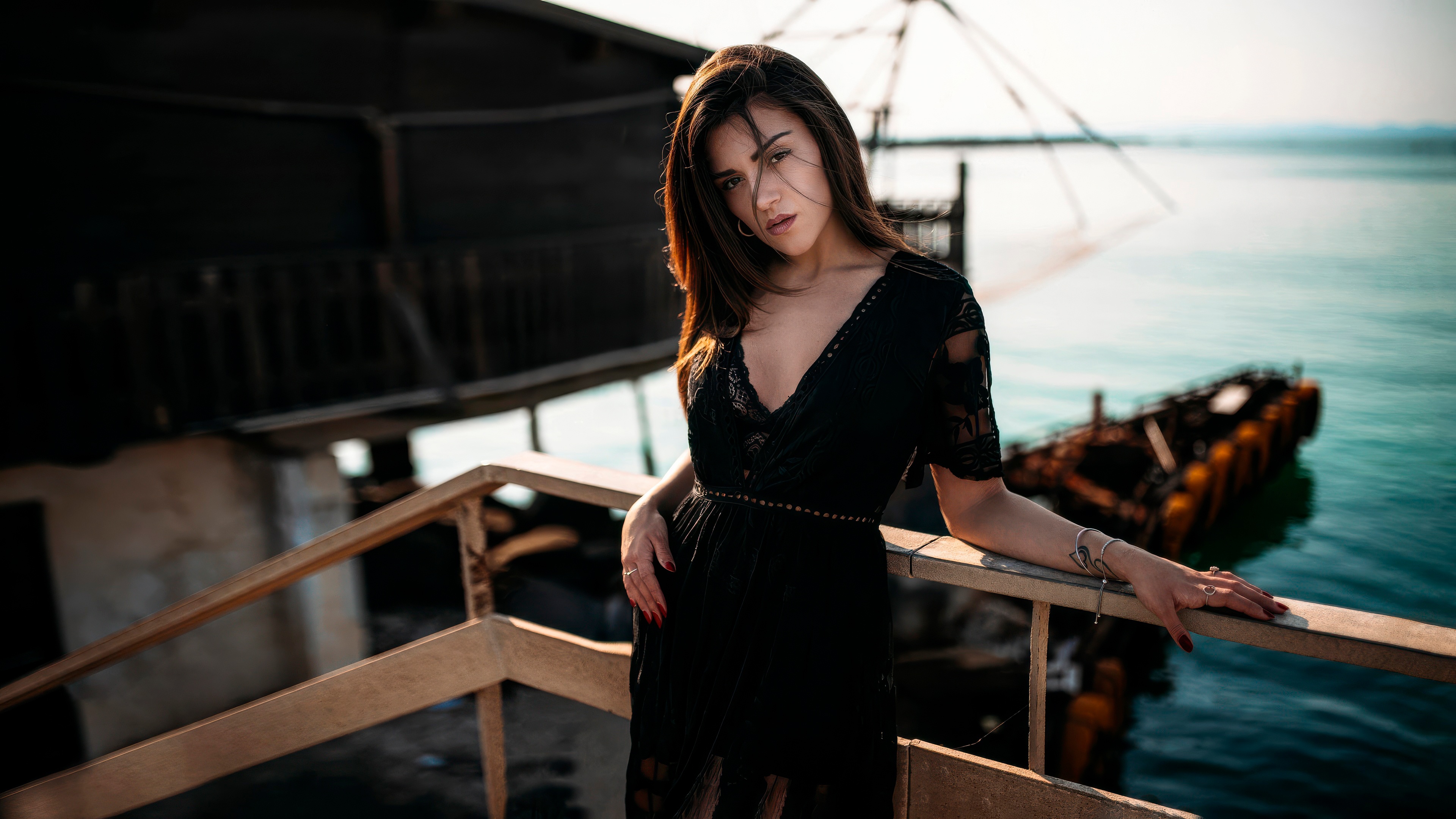 Girl in black dress on a pier HD Wallpaper