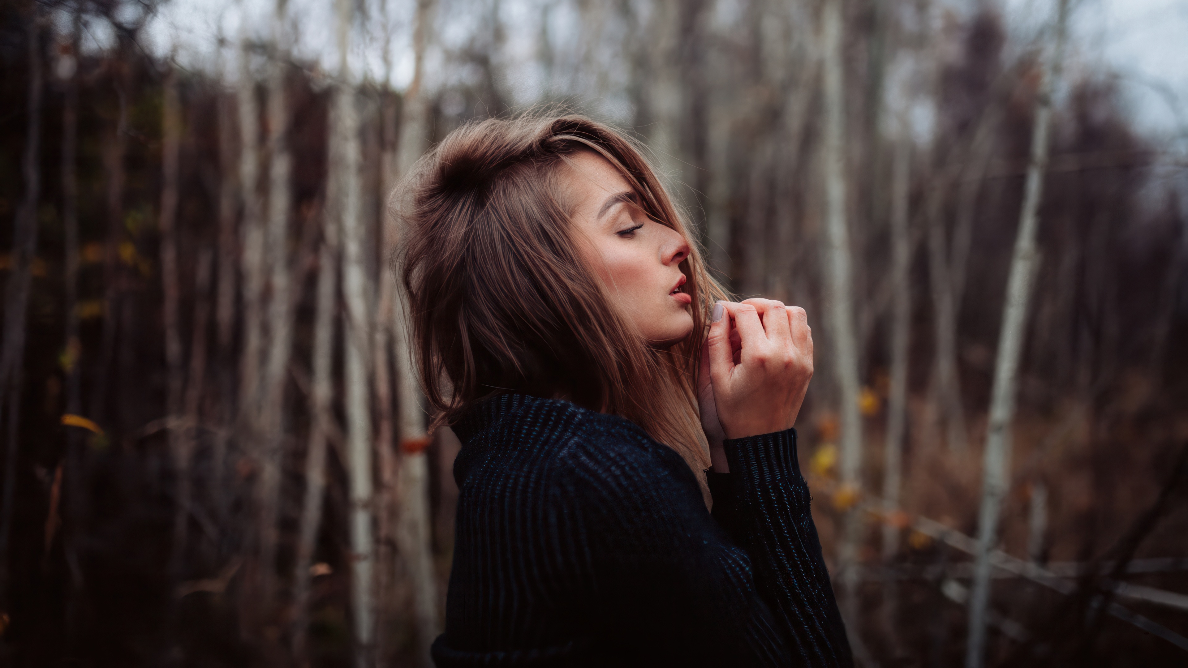 Girl in a dark sweater in the woods HD Wallpaper