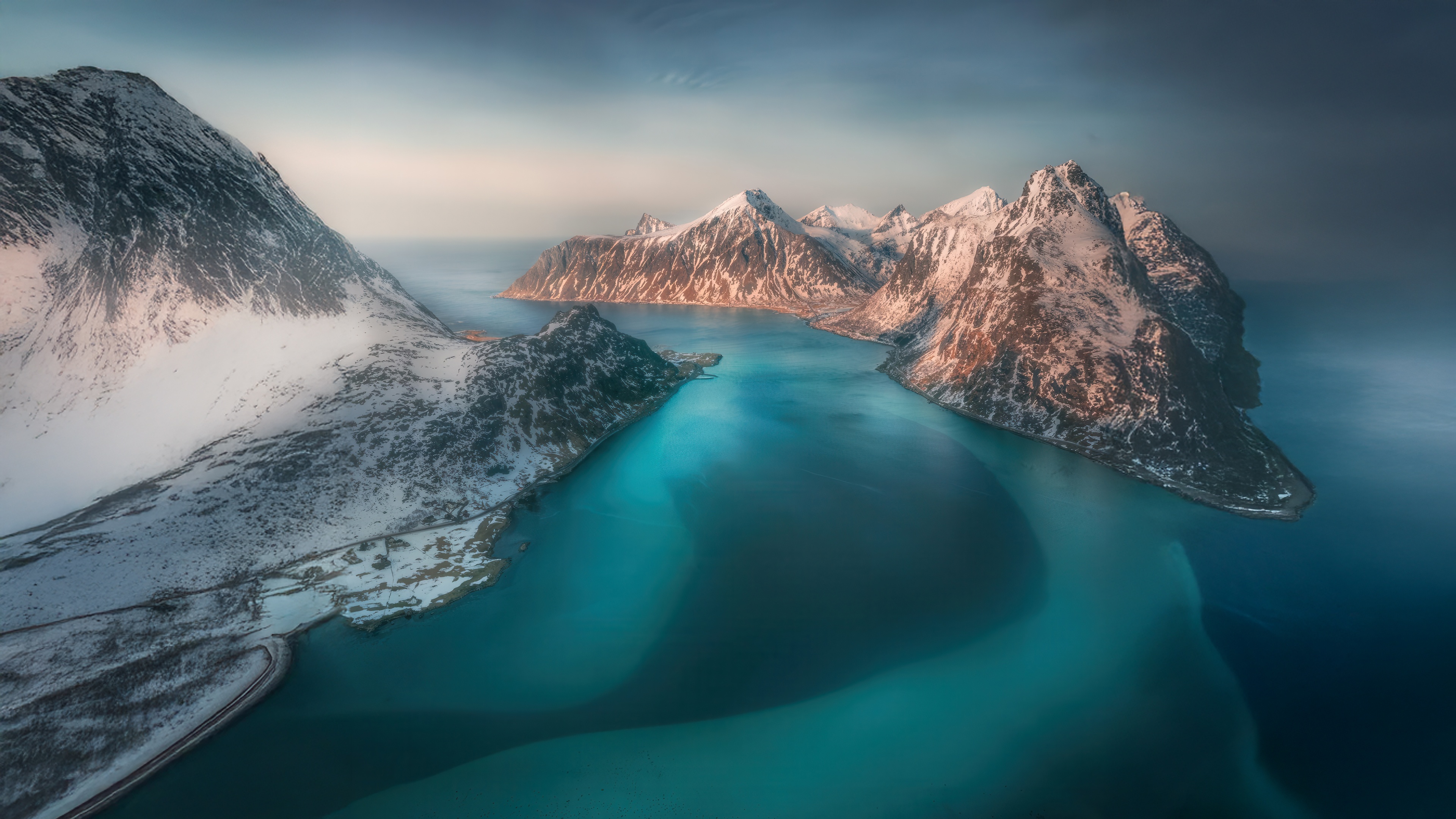 Snow-capped mountains and turquoise water in Lofoten, Norway HD Wallpaper