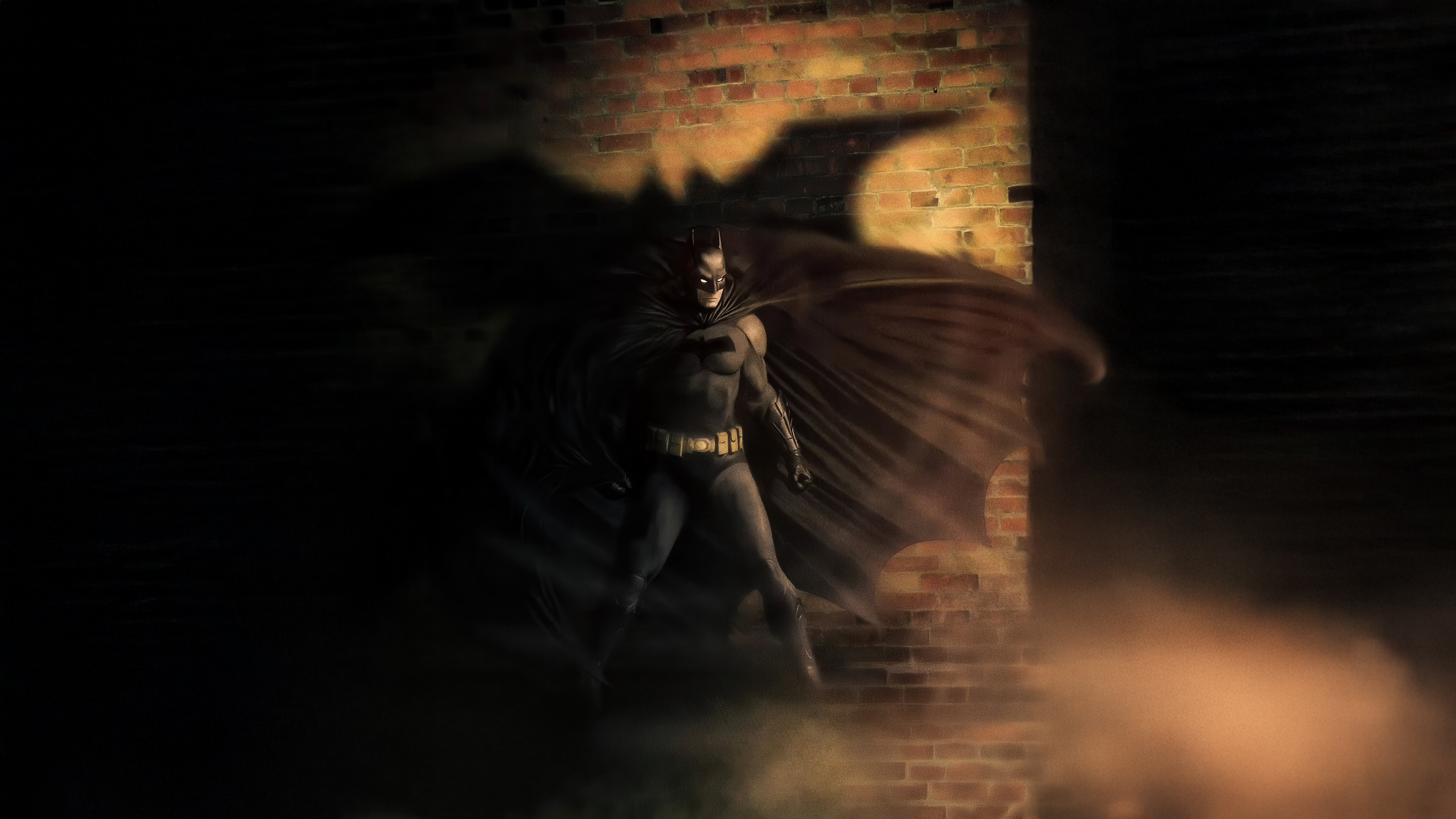 Batman standing in front of a brick wall with his shadow HD Wallpaper
