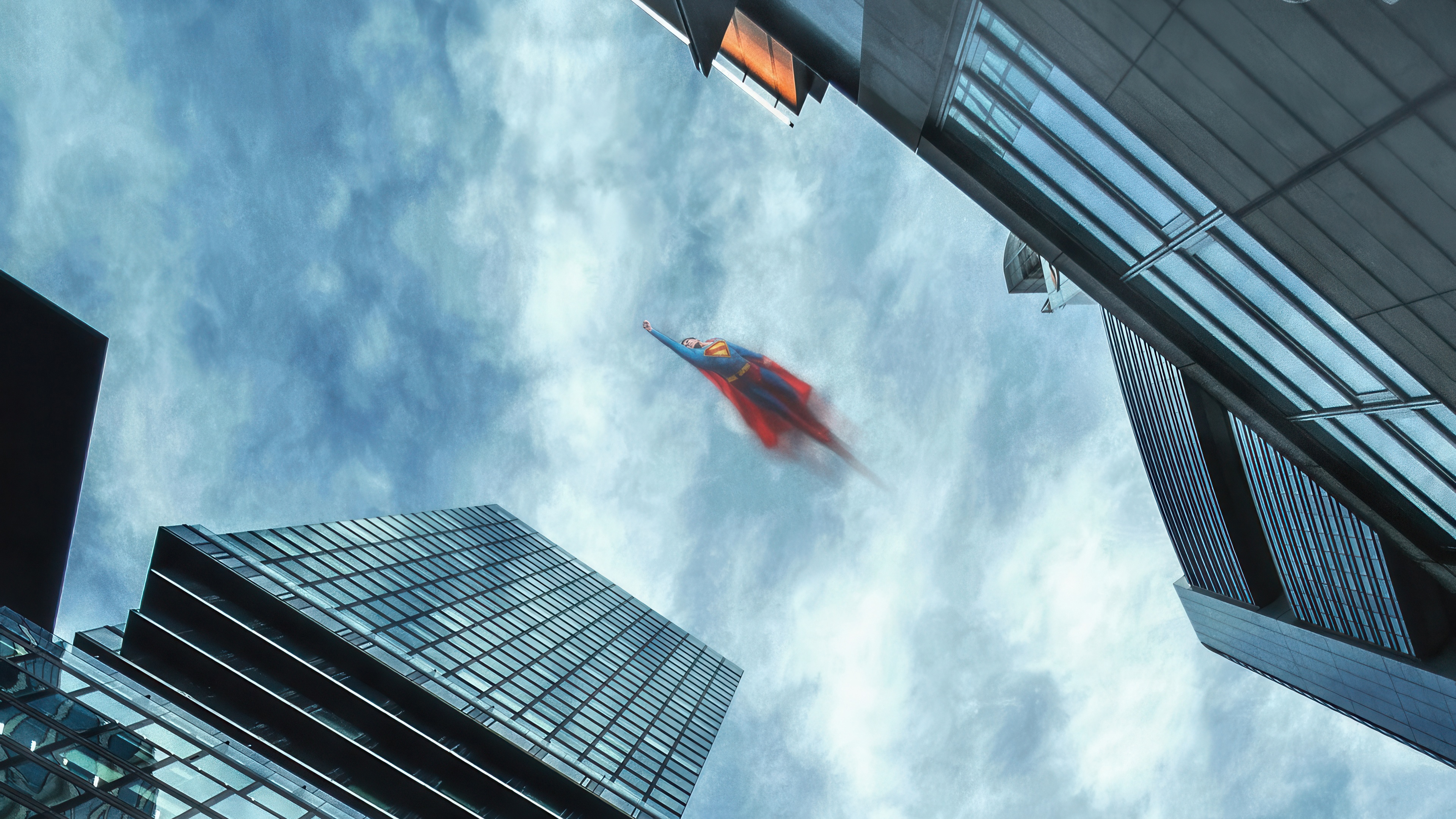 Superman flying between skyscrapers HD Wallpaper