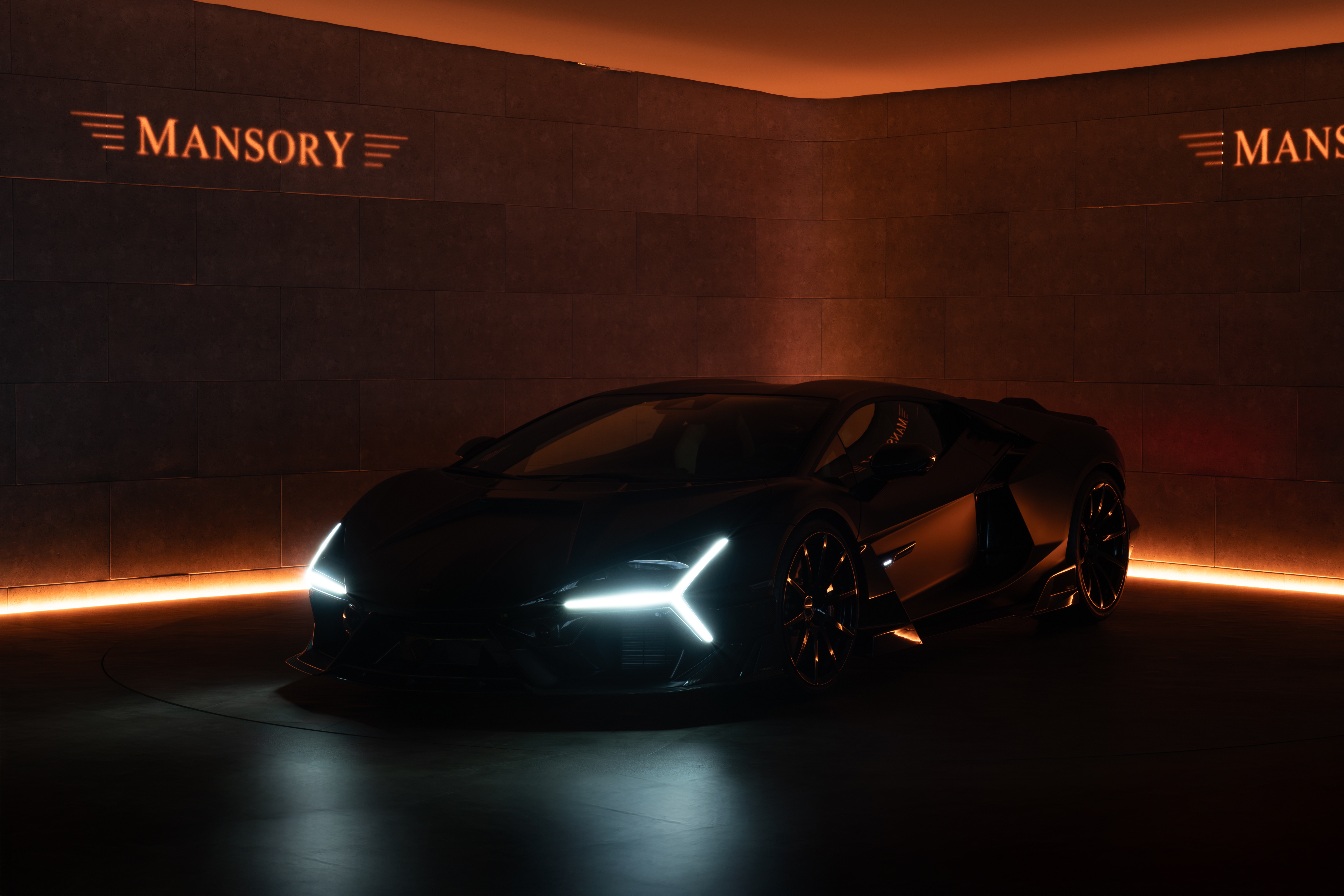 Mansory Initiate supercar in a dark studio HD Wallpaper