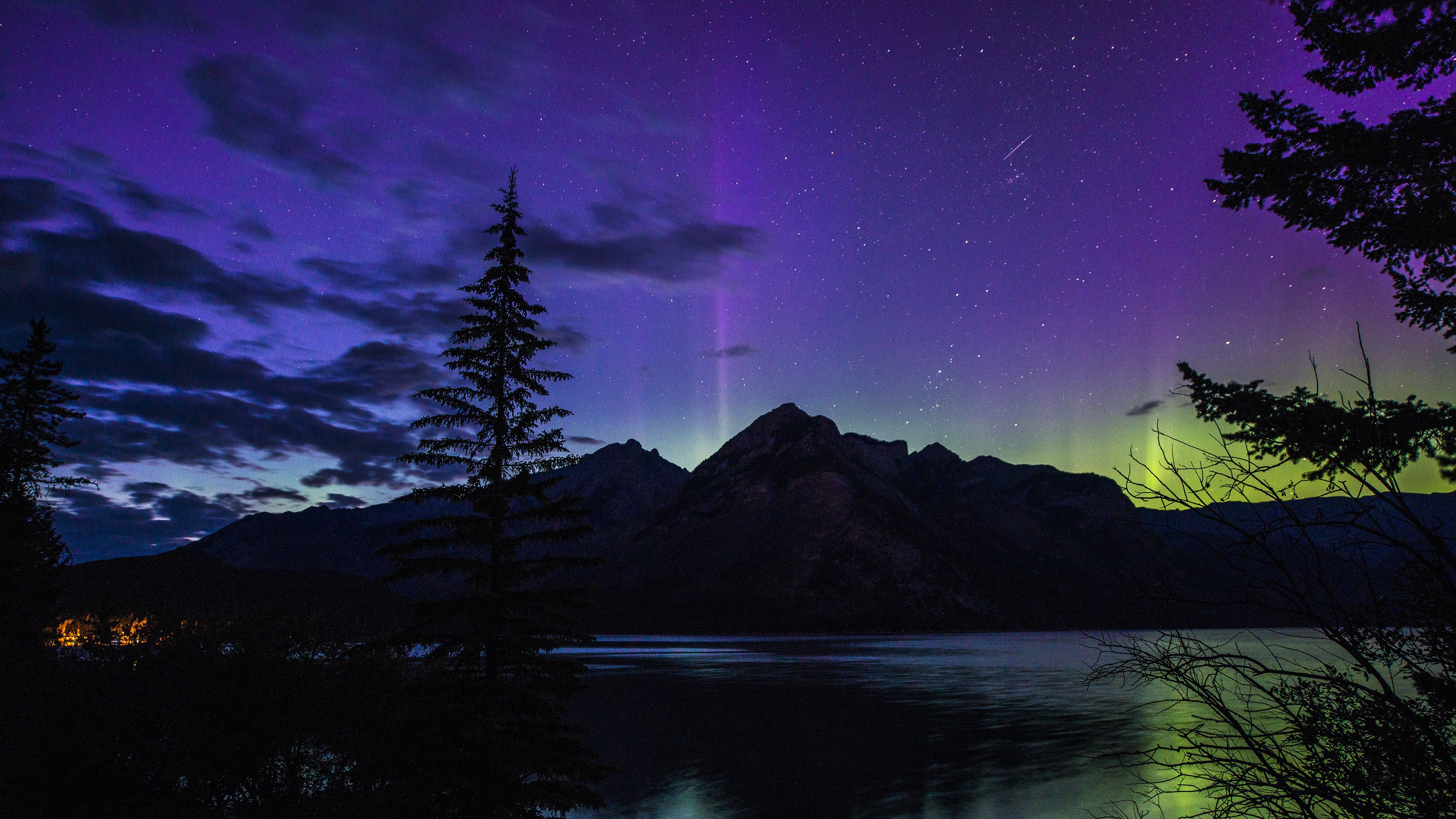 Aurora Borealis over mountains and lake at night HD Wallpaper