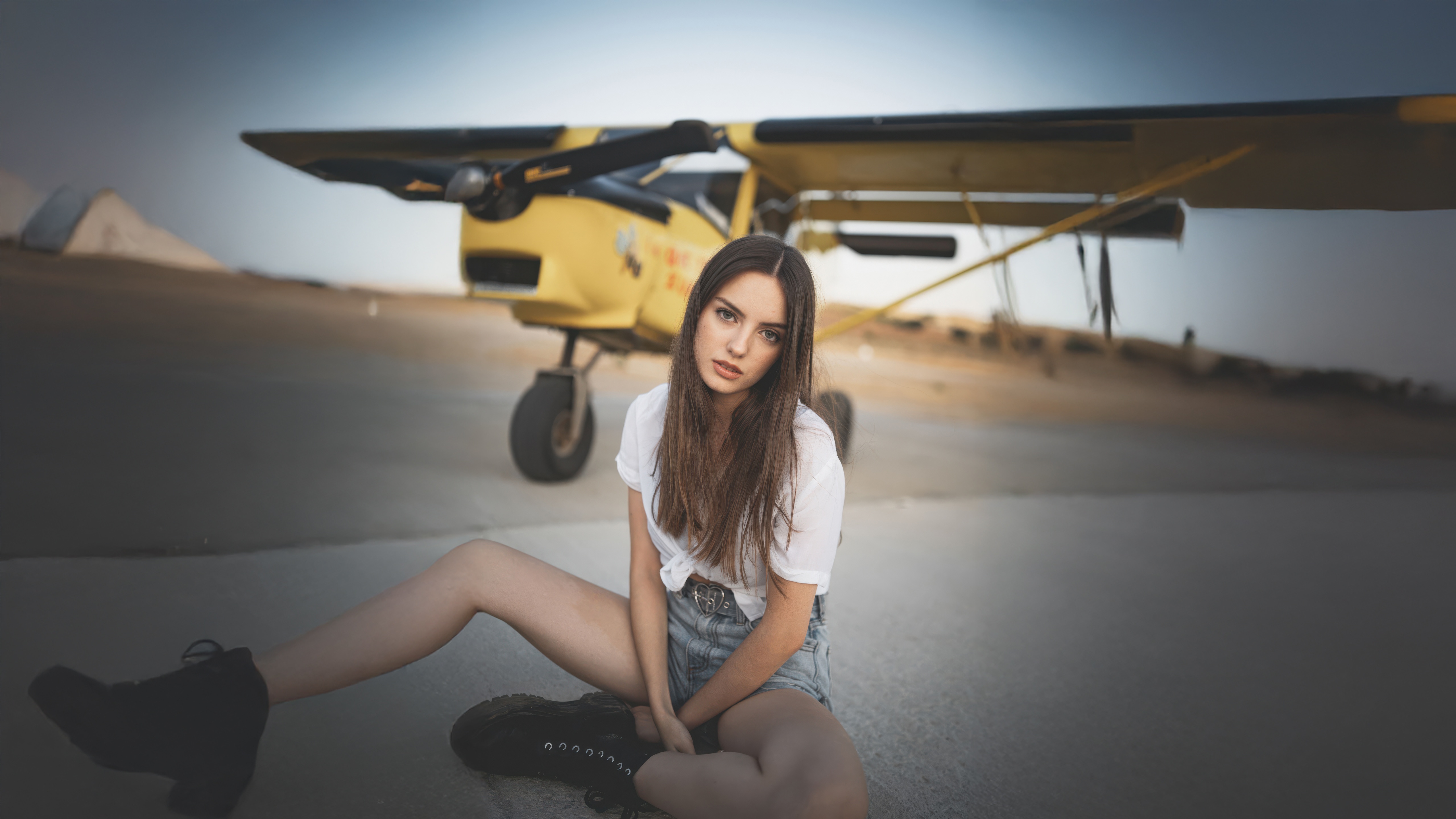 Girl Posing Beside a Yellow Airplane HD Wallpaper