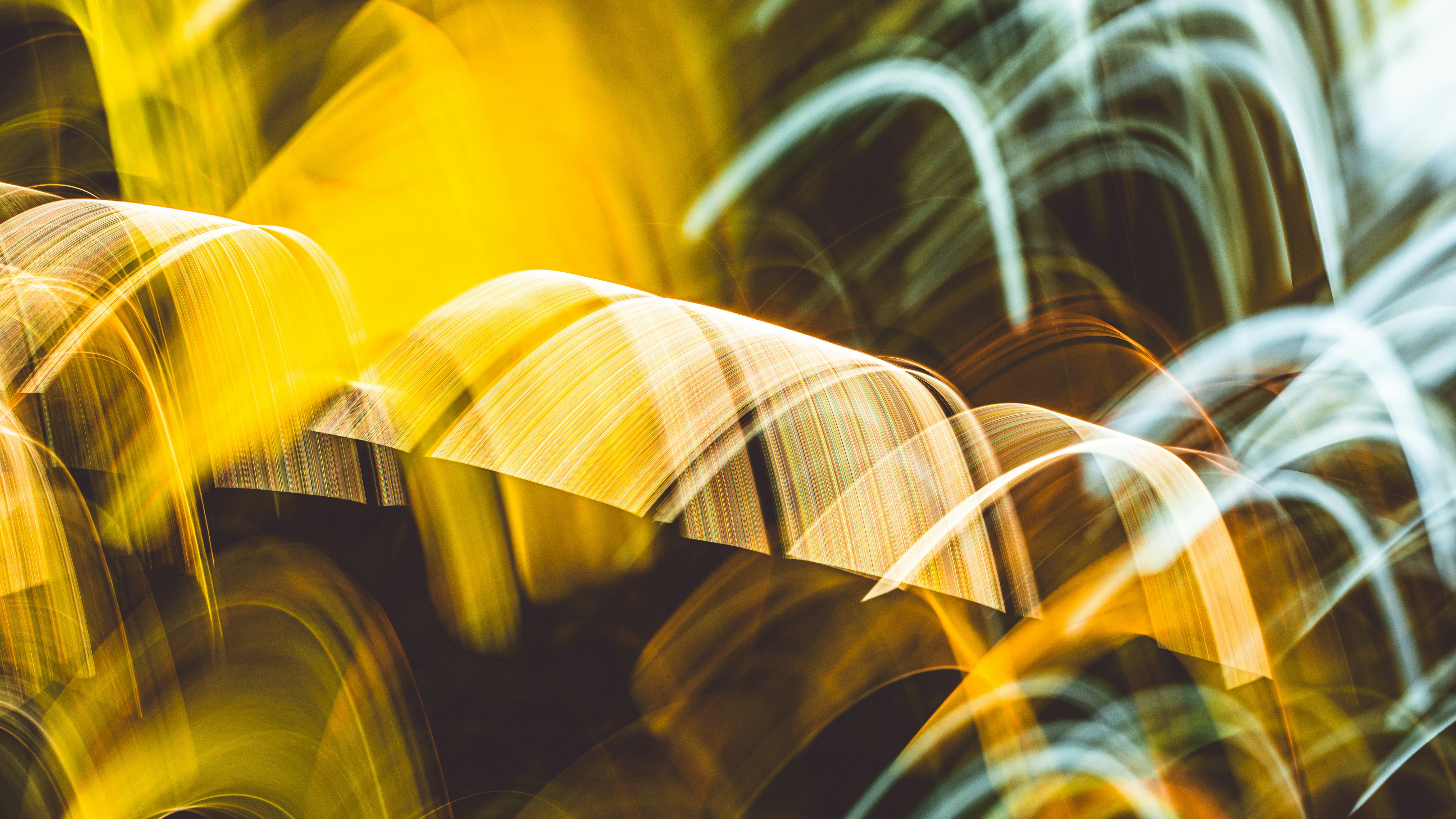 Abstract swirls of yellow and white light HD Wallpaper
