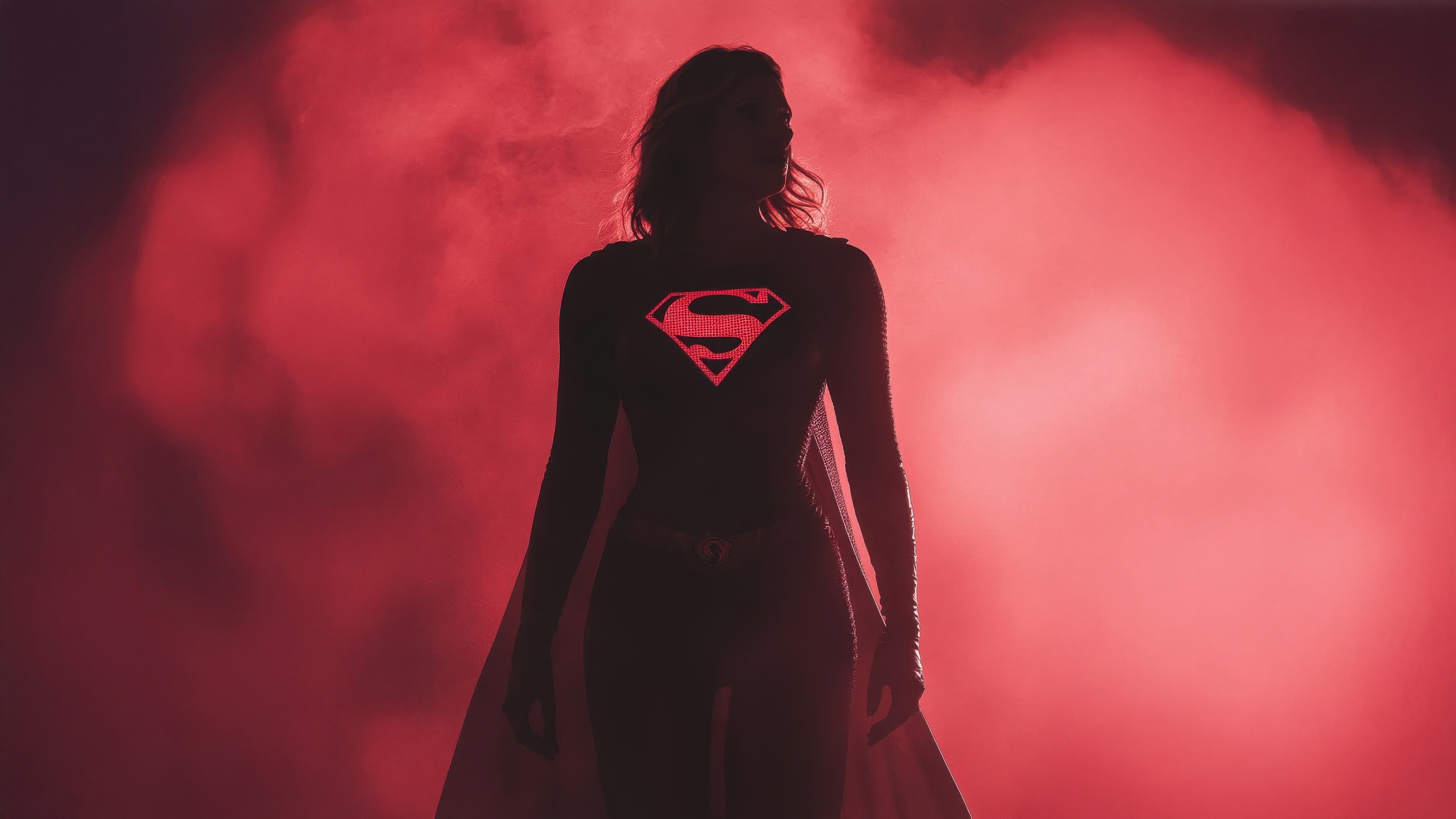 Supergirl in red smoke with Superman logo HD Wallpaper