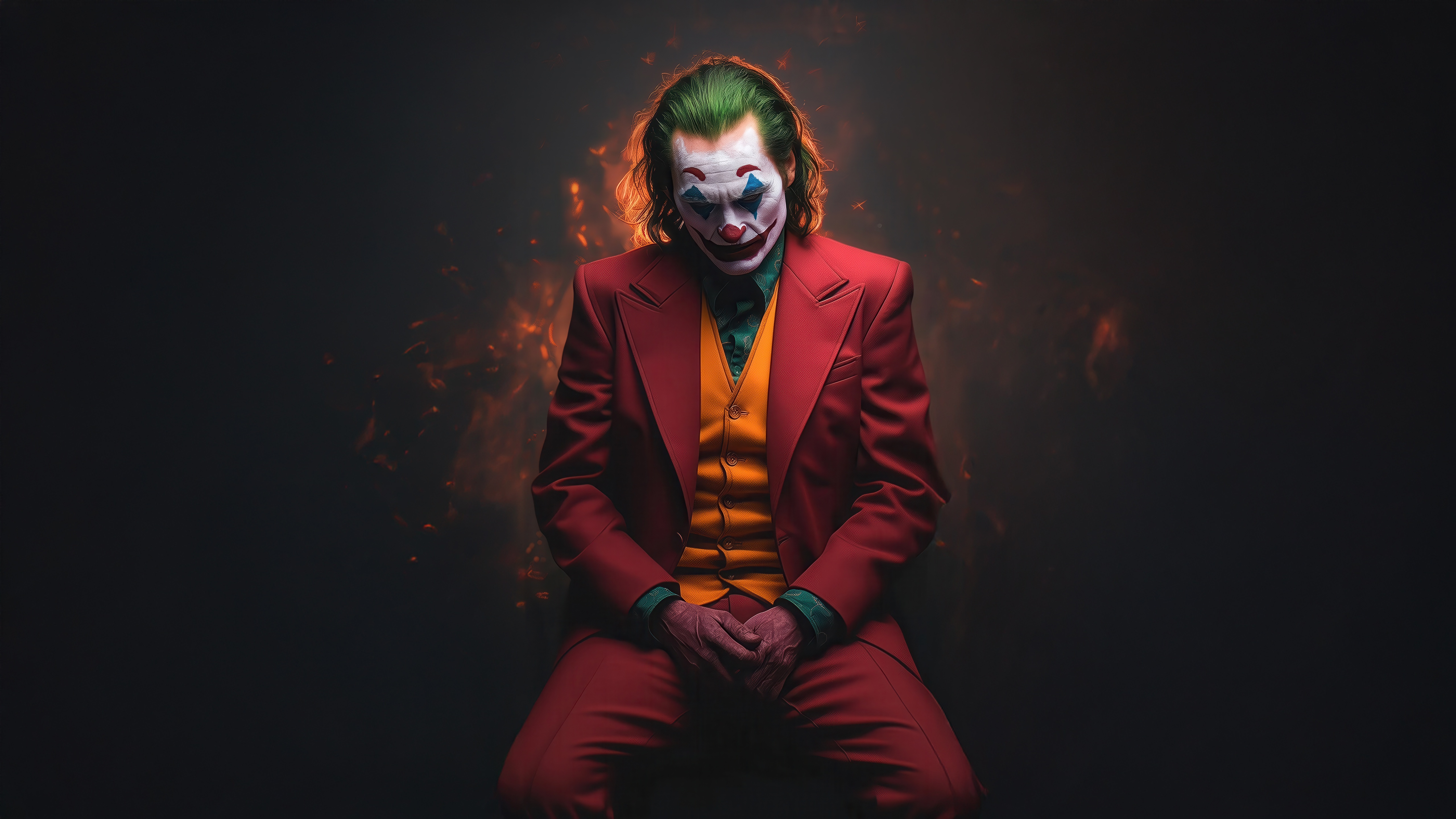 Joker sitting with hands clasped HD Wallpaper