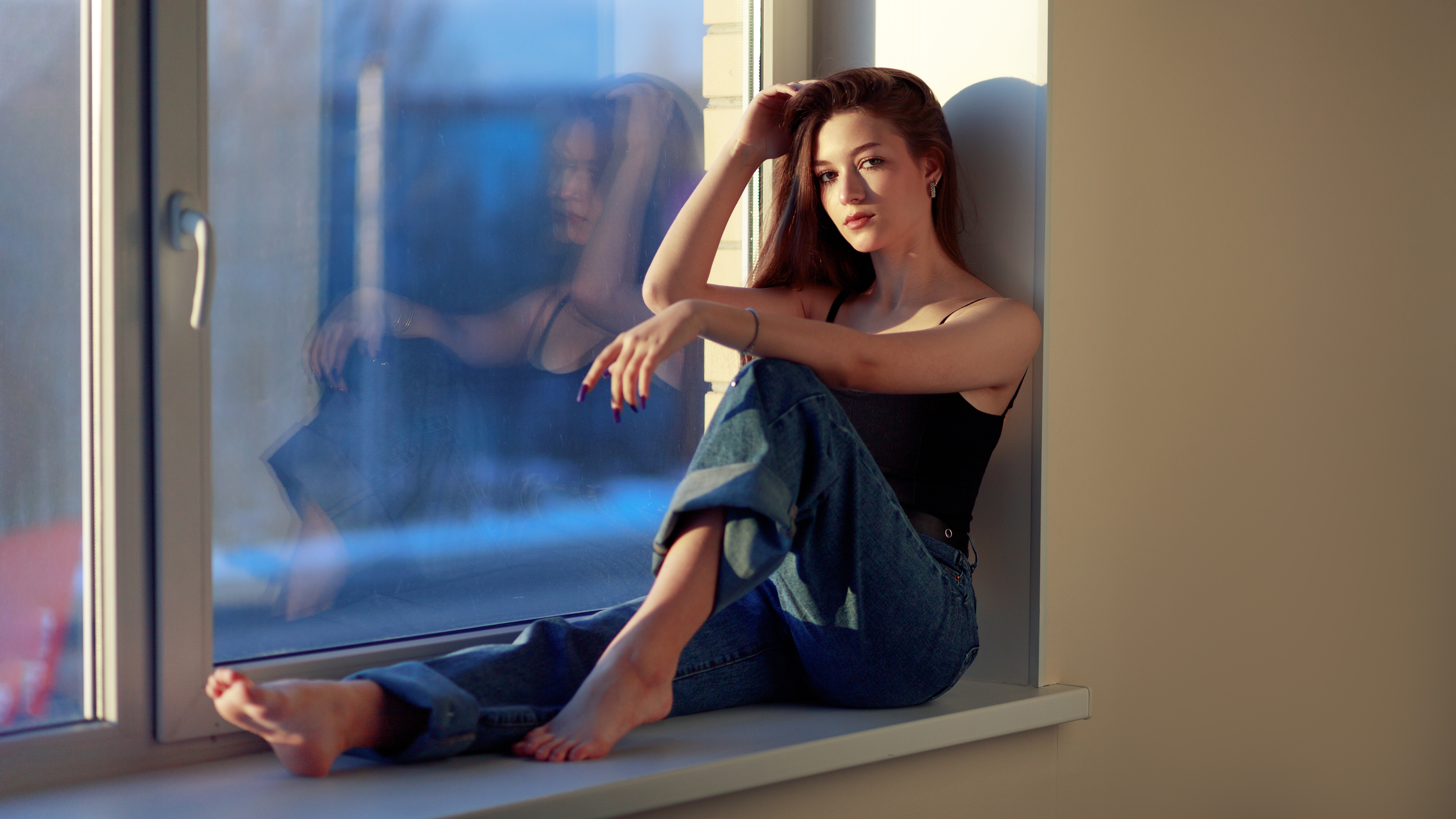 Girl sitting on a windowsill by the window HD Wallpaper