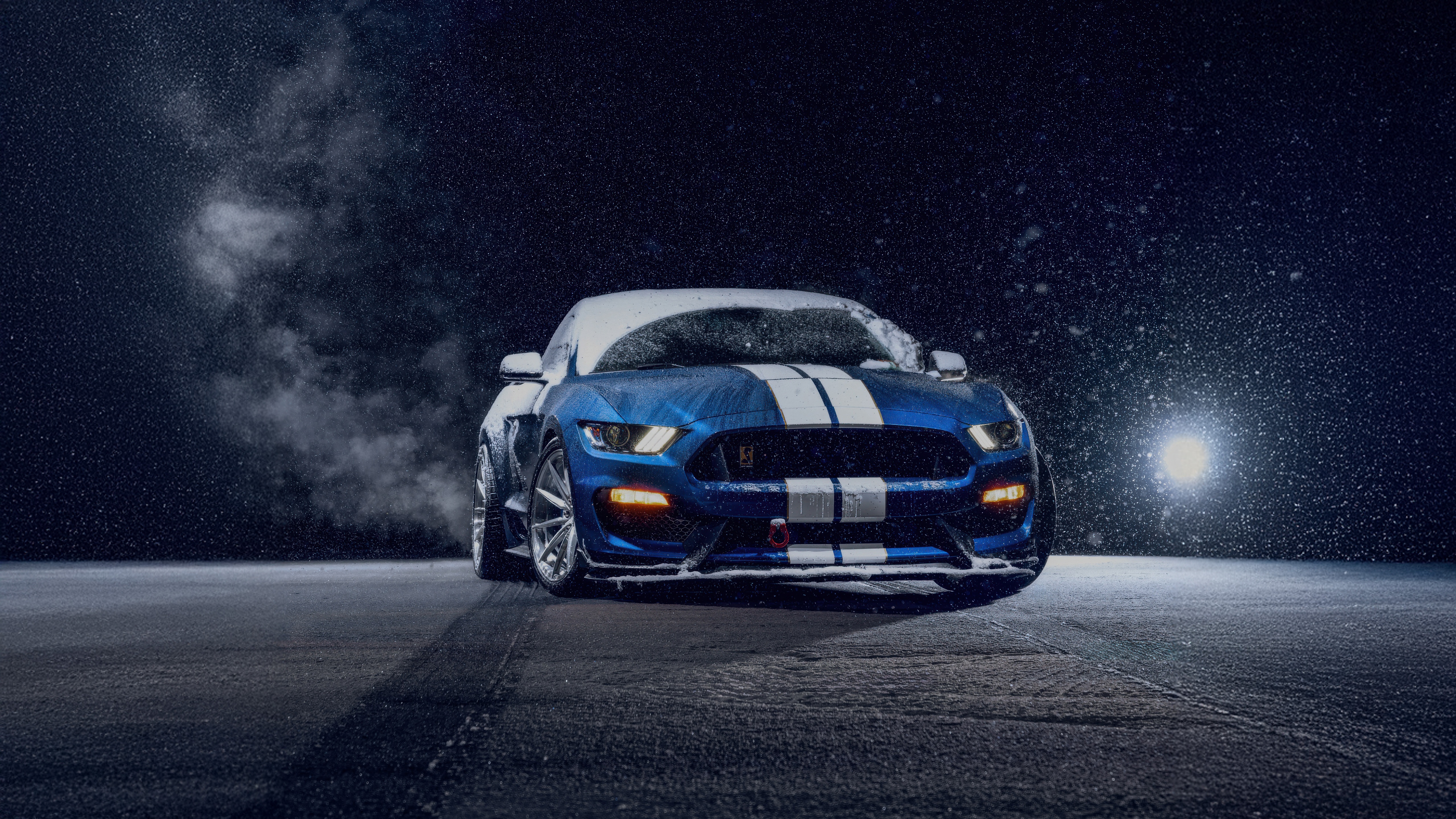 Blue Ford Mustang with white stripes in snow HD Wallpaper