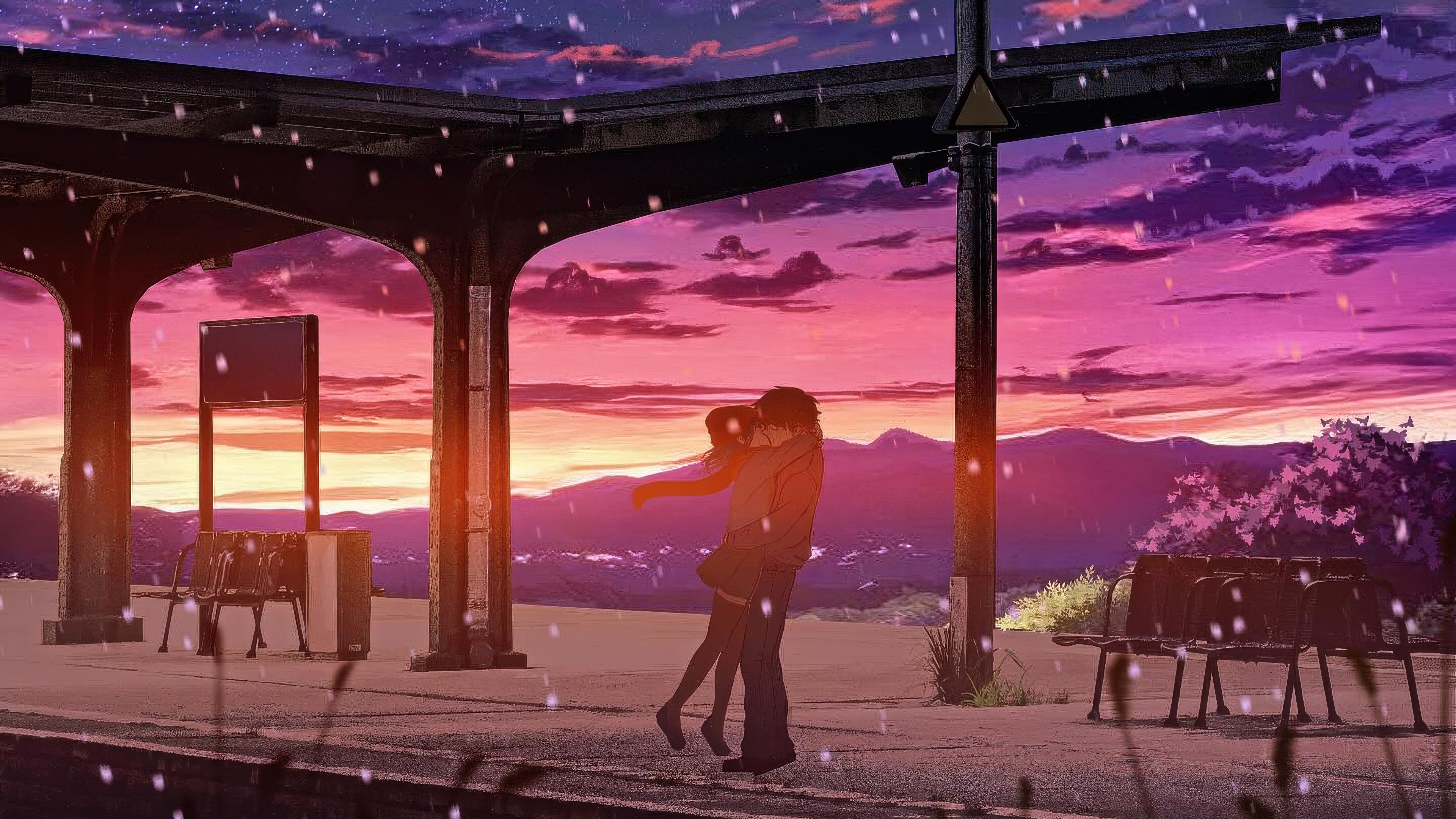 Couple kissing at a train station during sunset HD Wallpaper