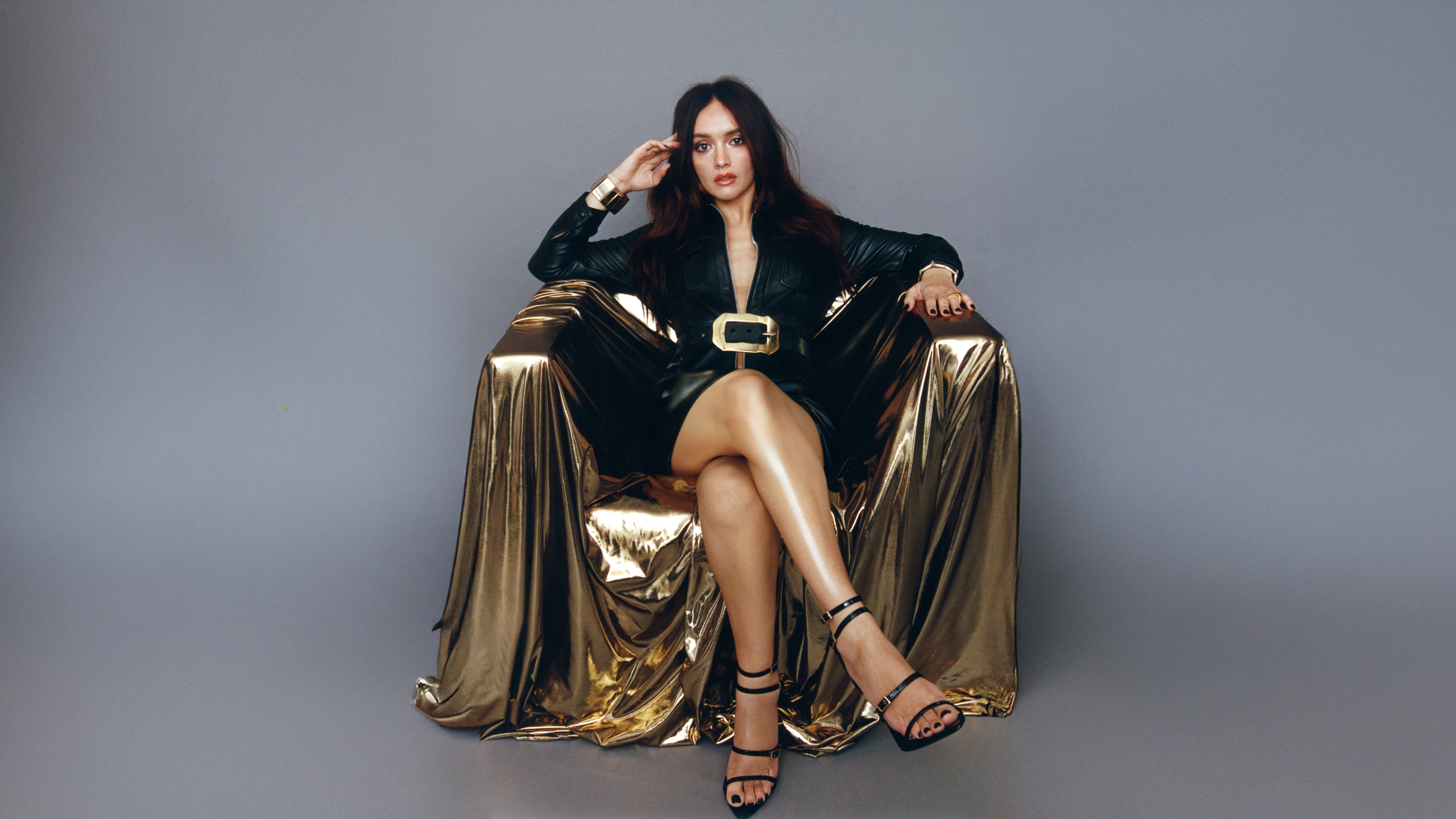 Olivia Cooke in a gold chair HD Wallpaper