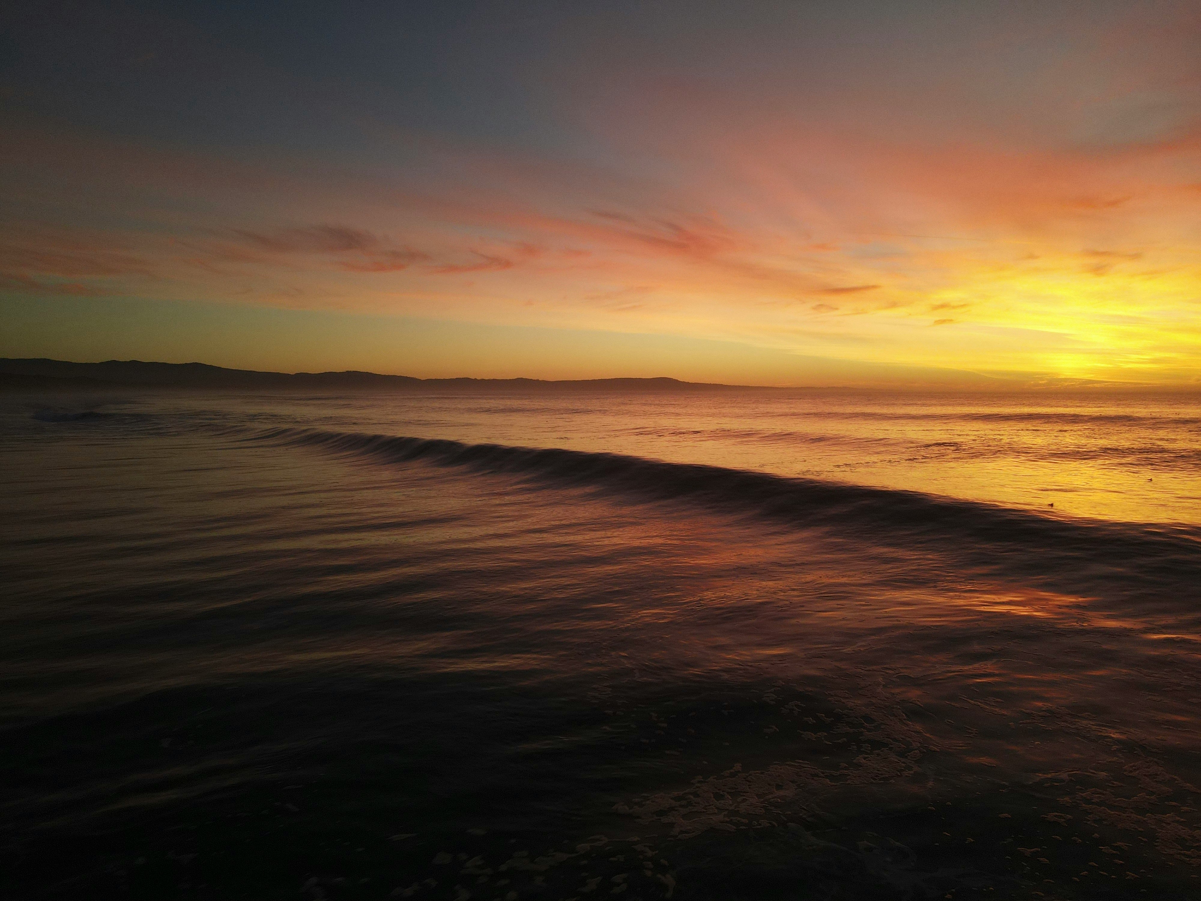 Sunset over the ocean at Marina State Beach, California HD Wallpaper