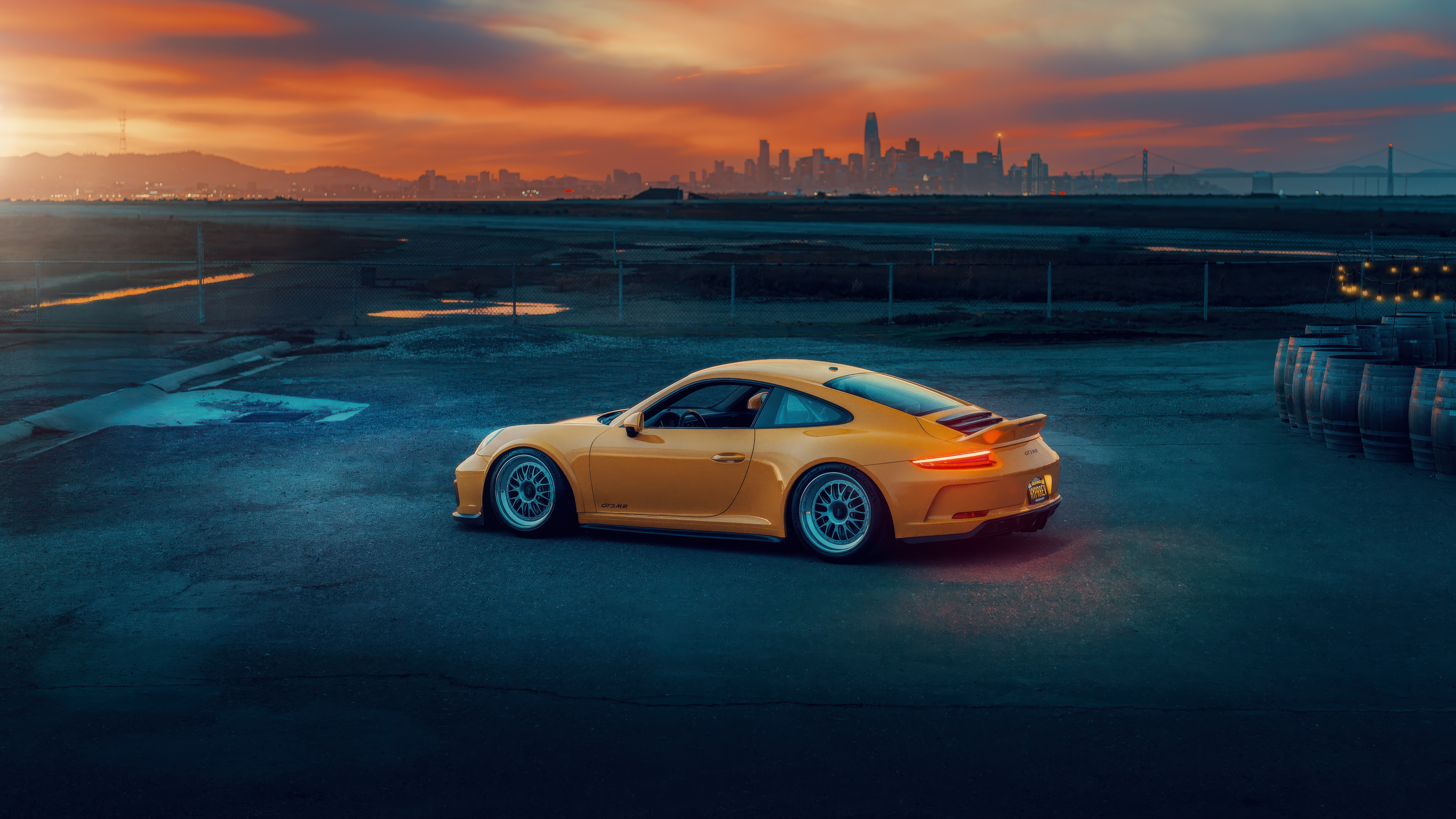 Yellow Porsche 911 GT3 RS at Sunset with City Skyline HD Wallpaper