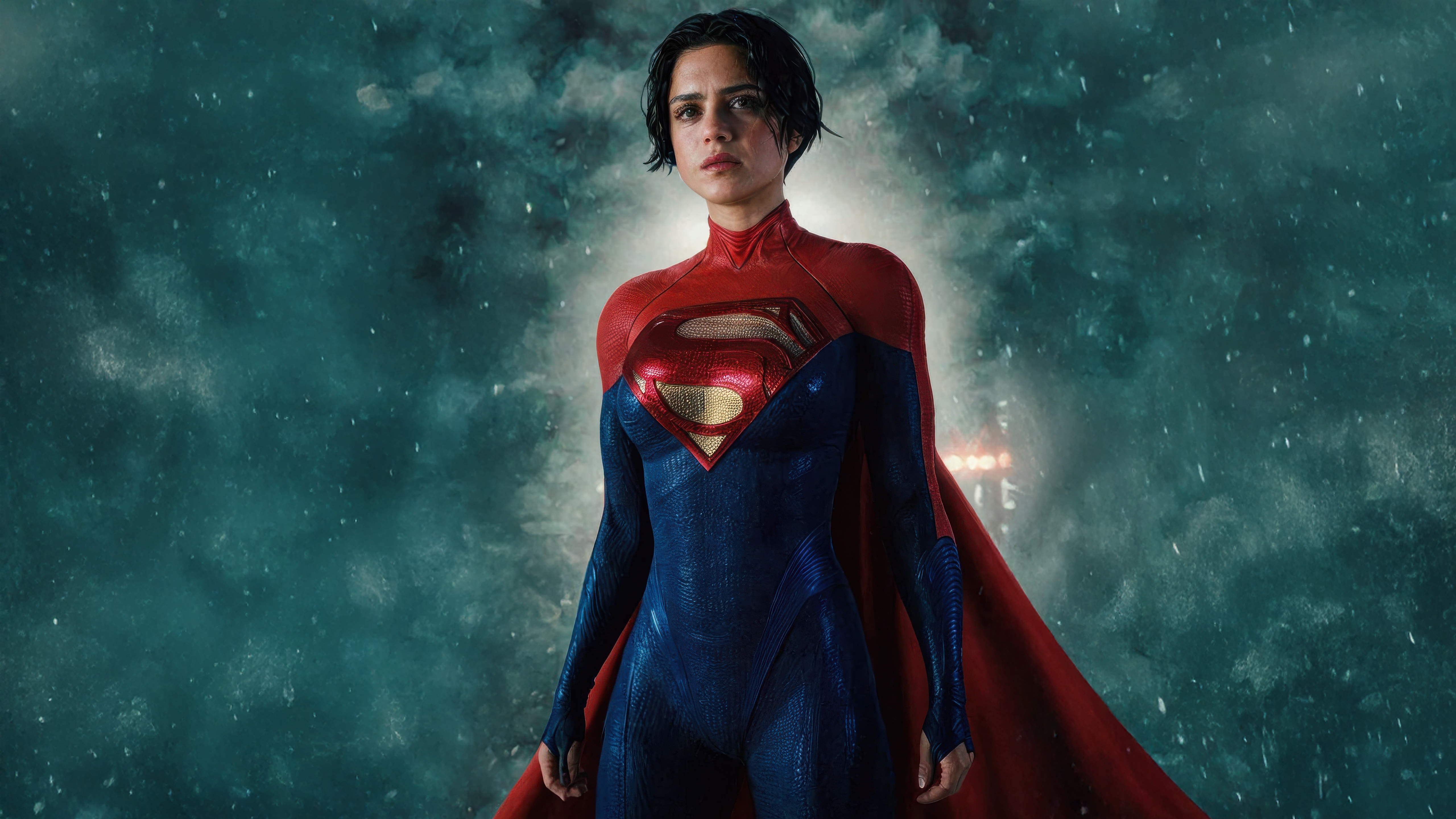 Supergirl in a blue and red suit with a cape HD Wallpaper