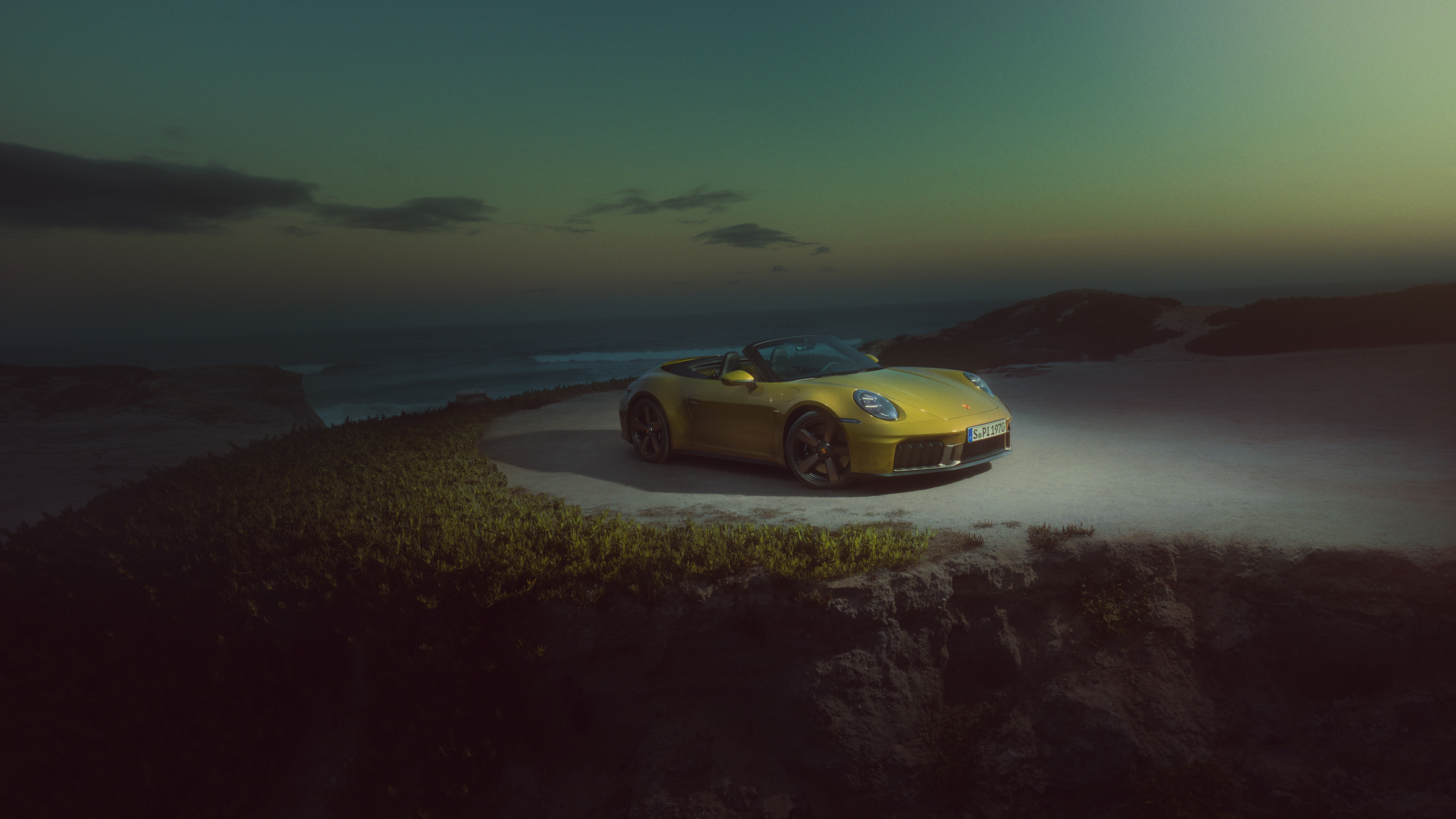 Yellow Porsche 911 convertible on a coastal road HD Wallpaper