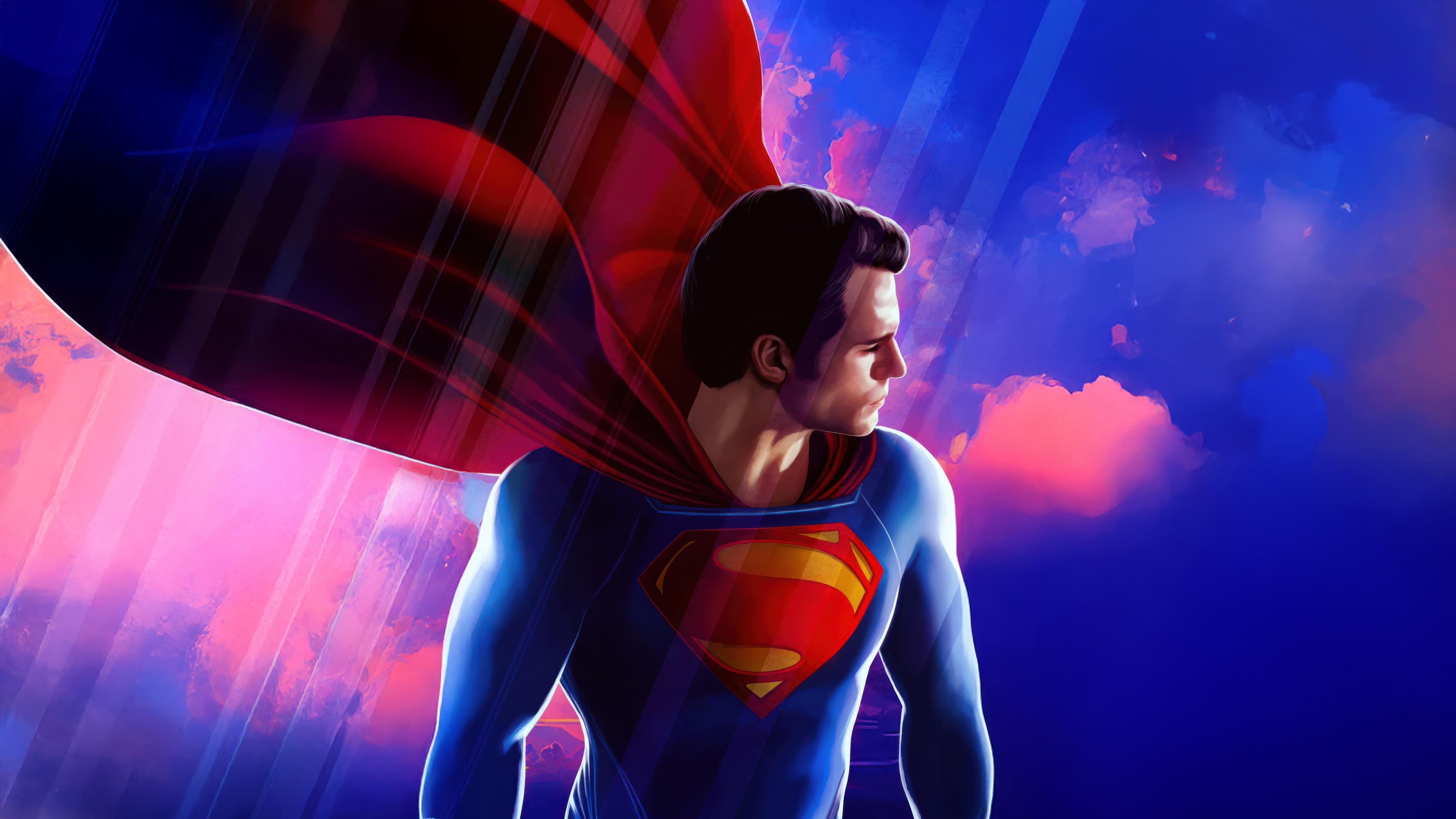 Superman in a red cape against a colorful sky HD Wallpaper