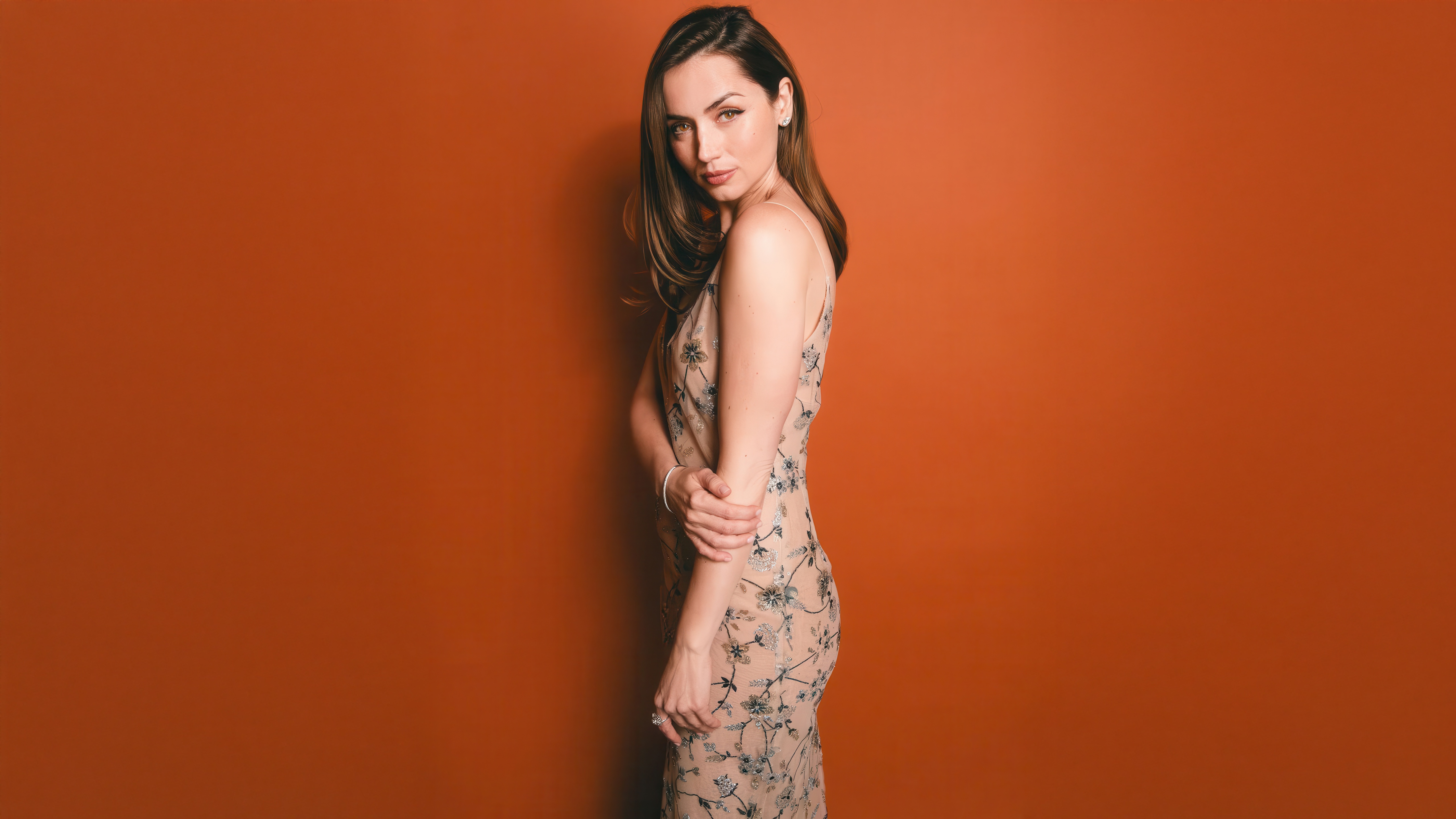 Ana De Armas Poses Against Orange Background HD Wallpaper