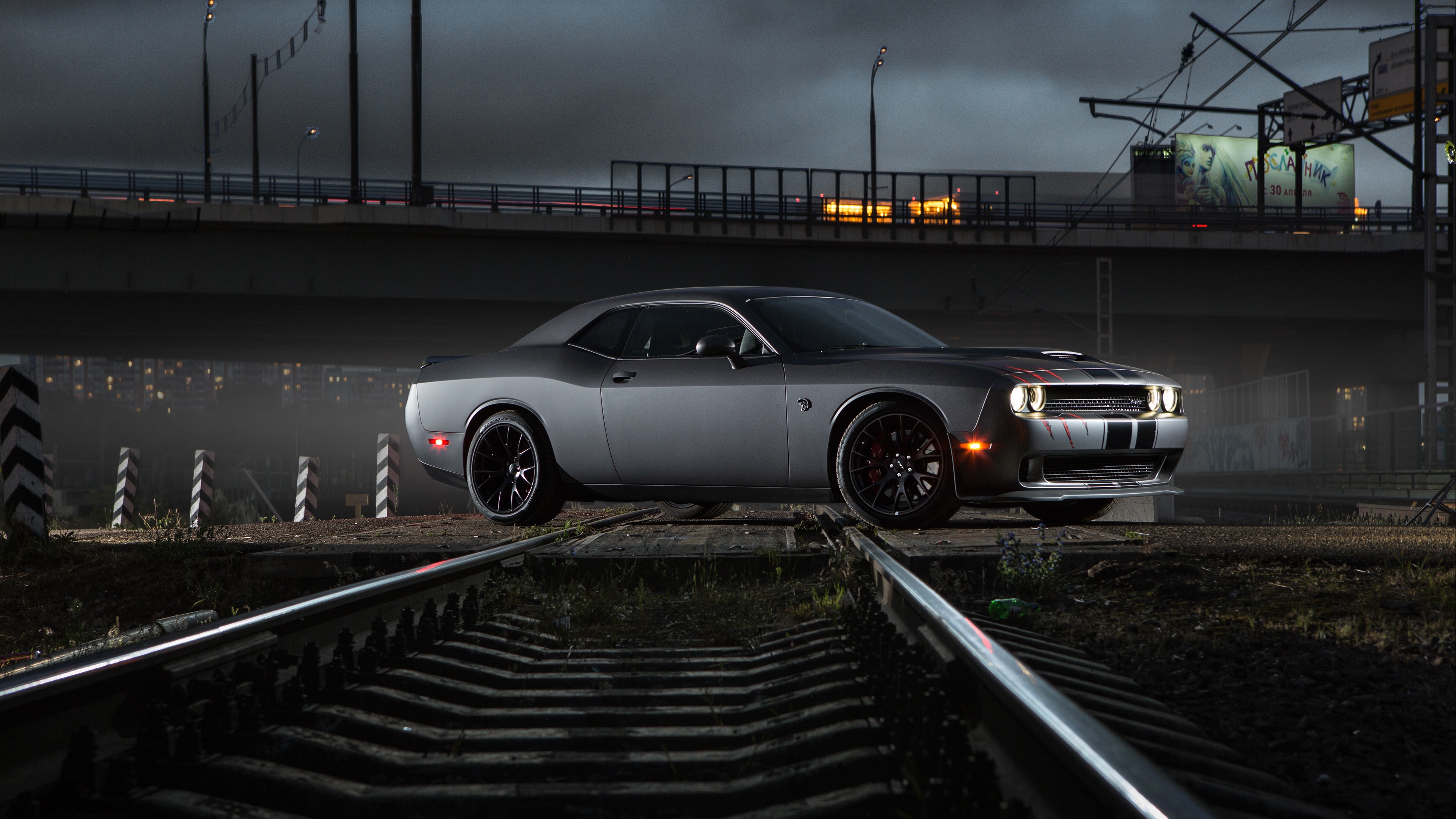 Dodge Challenger Hellcat on train tracks at night HD Wallpaper