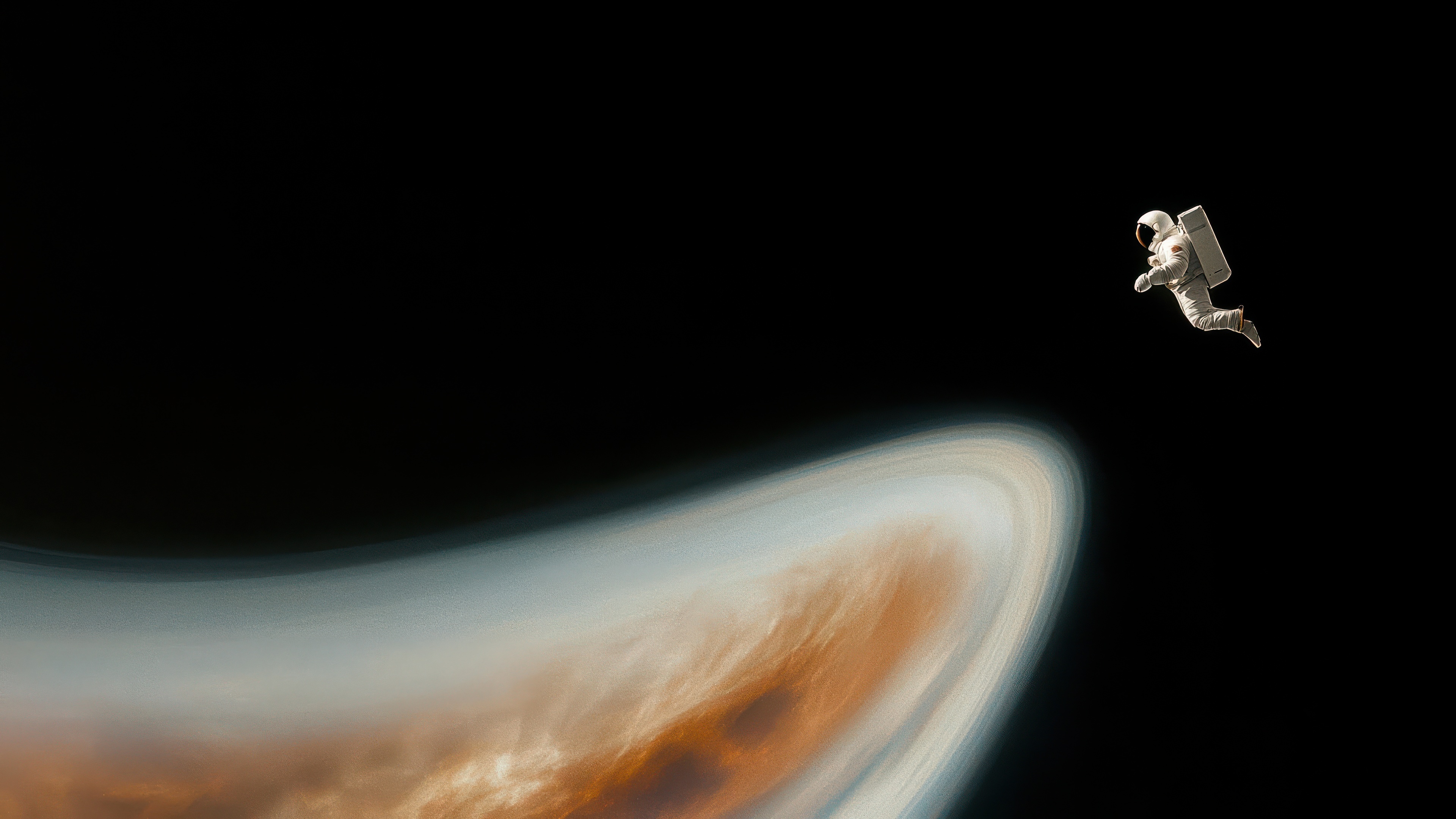Astronaut floating near a ringed planet HD Wallpaper