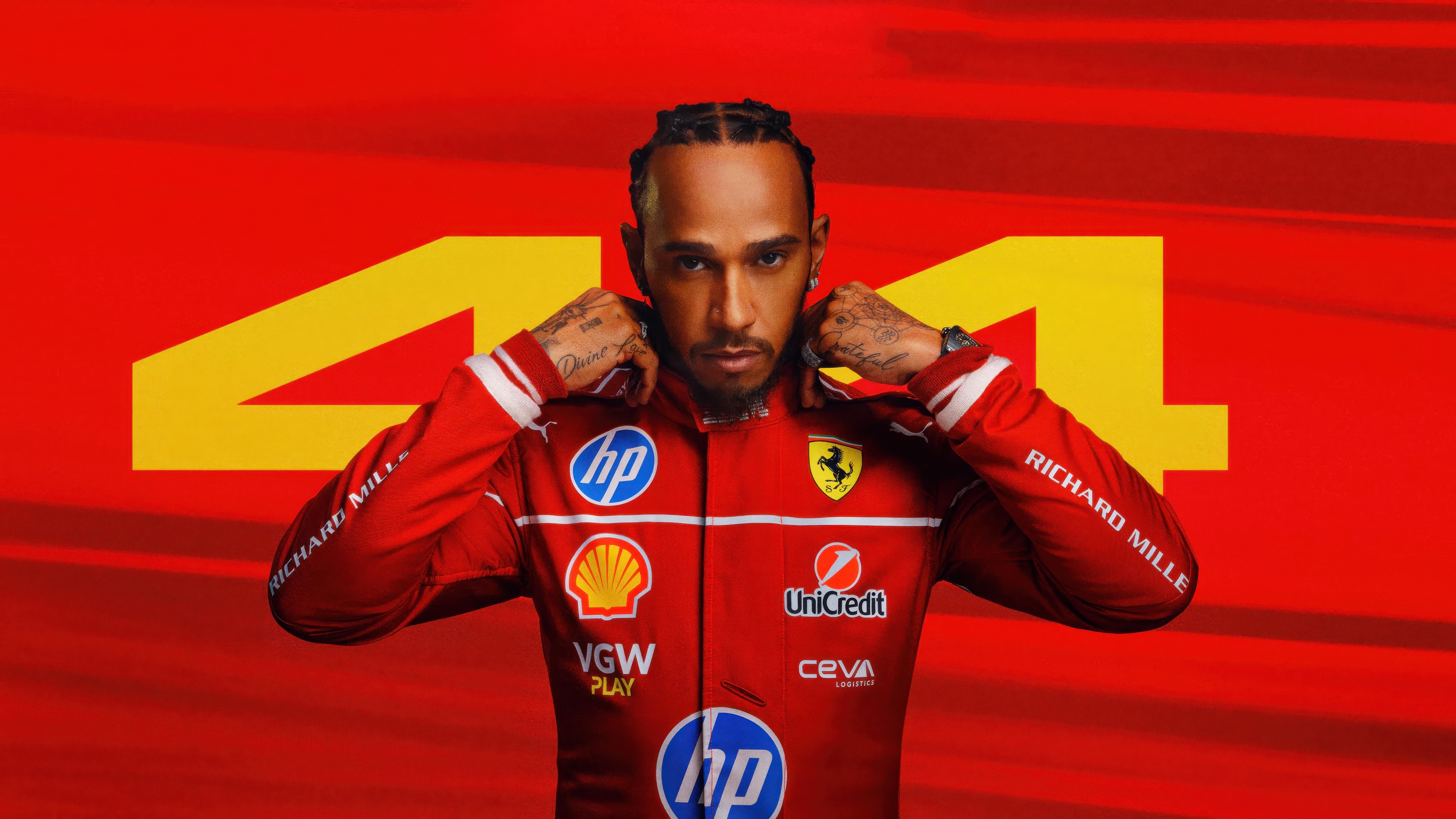 Lewis Hamilton in Ferrari Racing Suit HD Wallpaper
