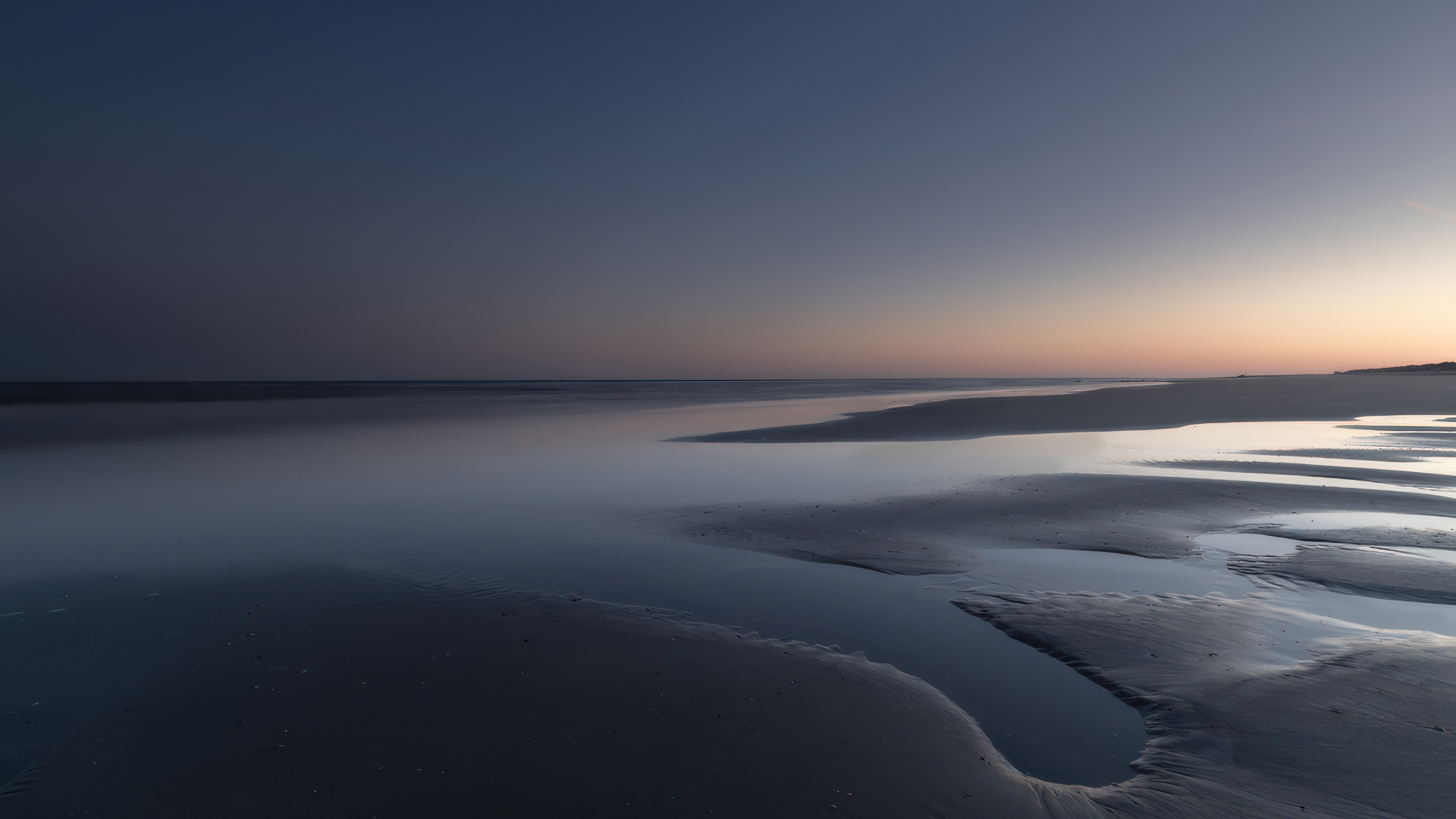 Minimalist seascape with calm ocean and wet sand HD Wallpaper