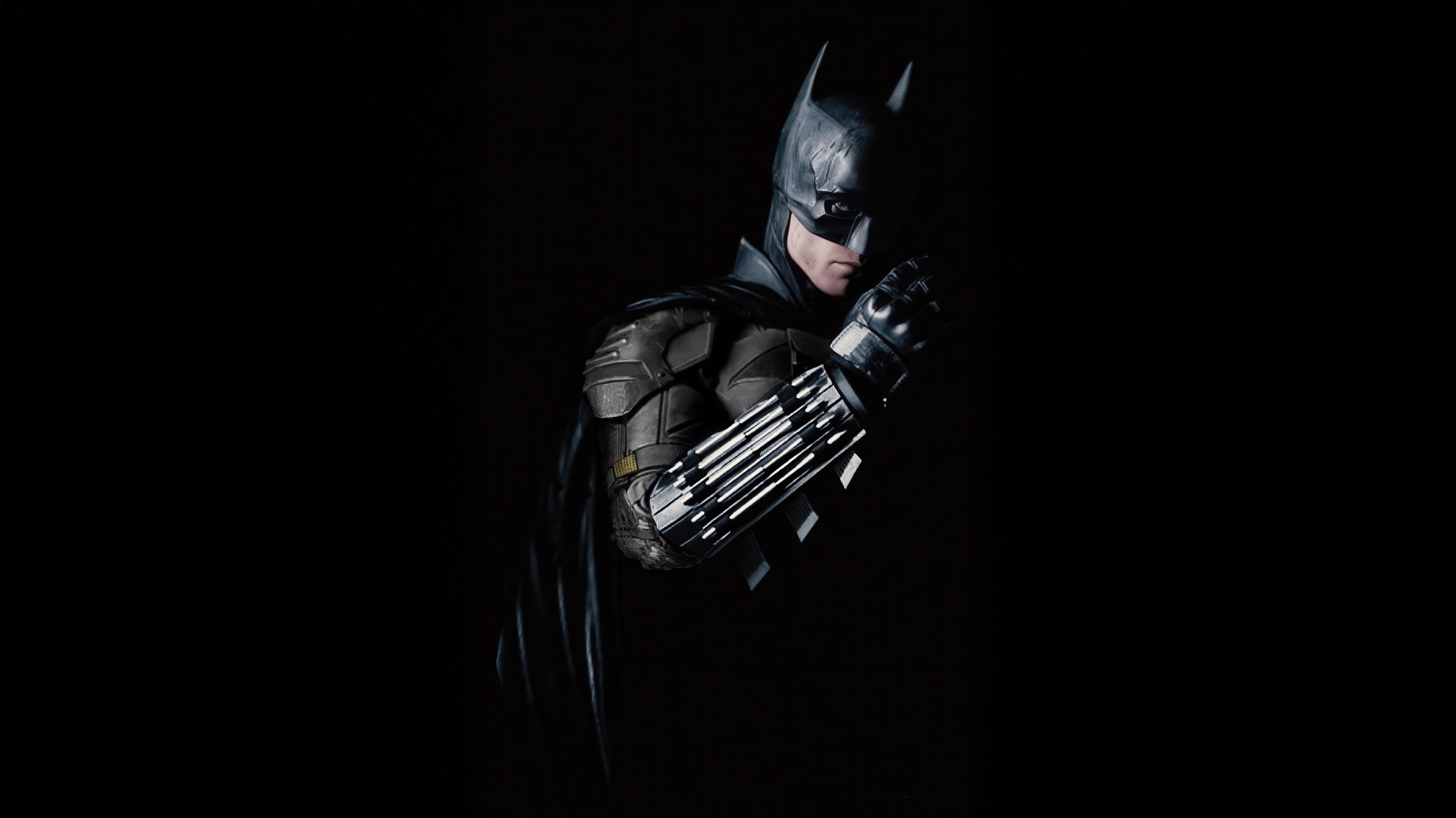 Batman in a dark suit with a cape HD Wallpaper