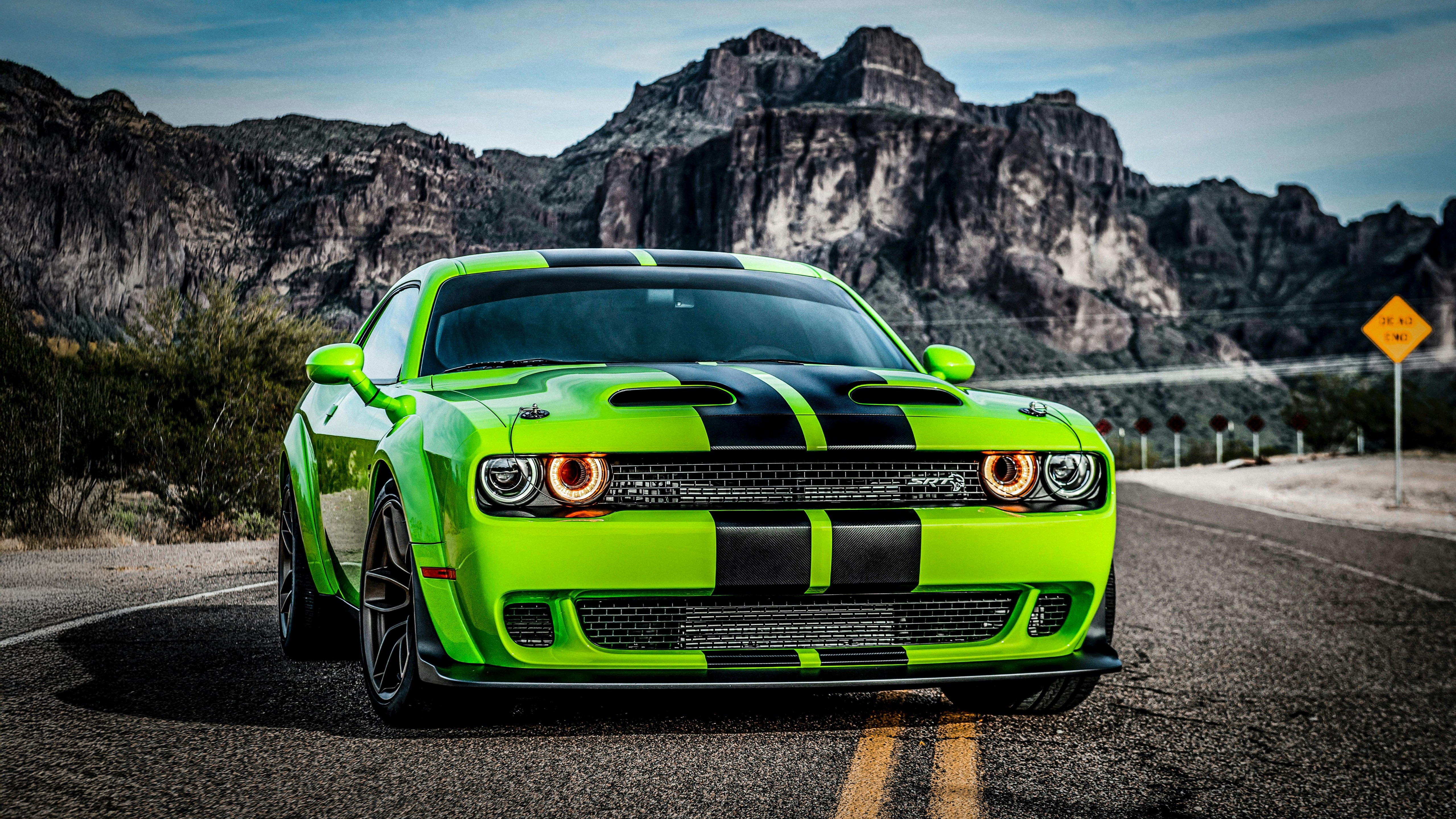 Glossy Green Dodge Challenger on a Mountain Road HD Wallpaper