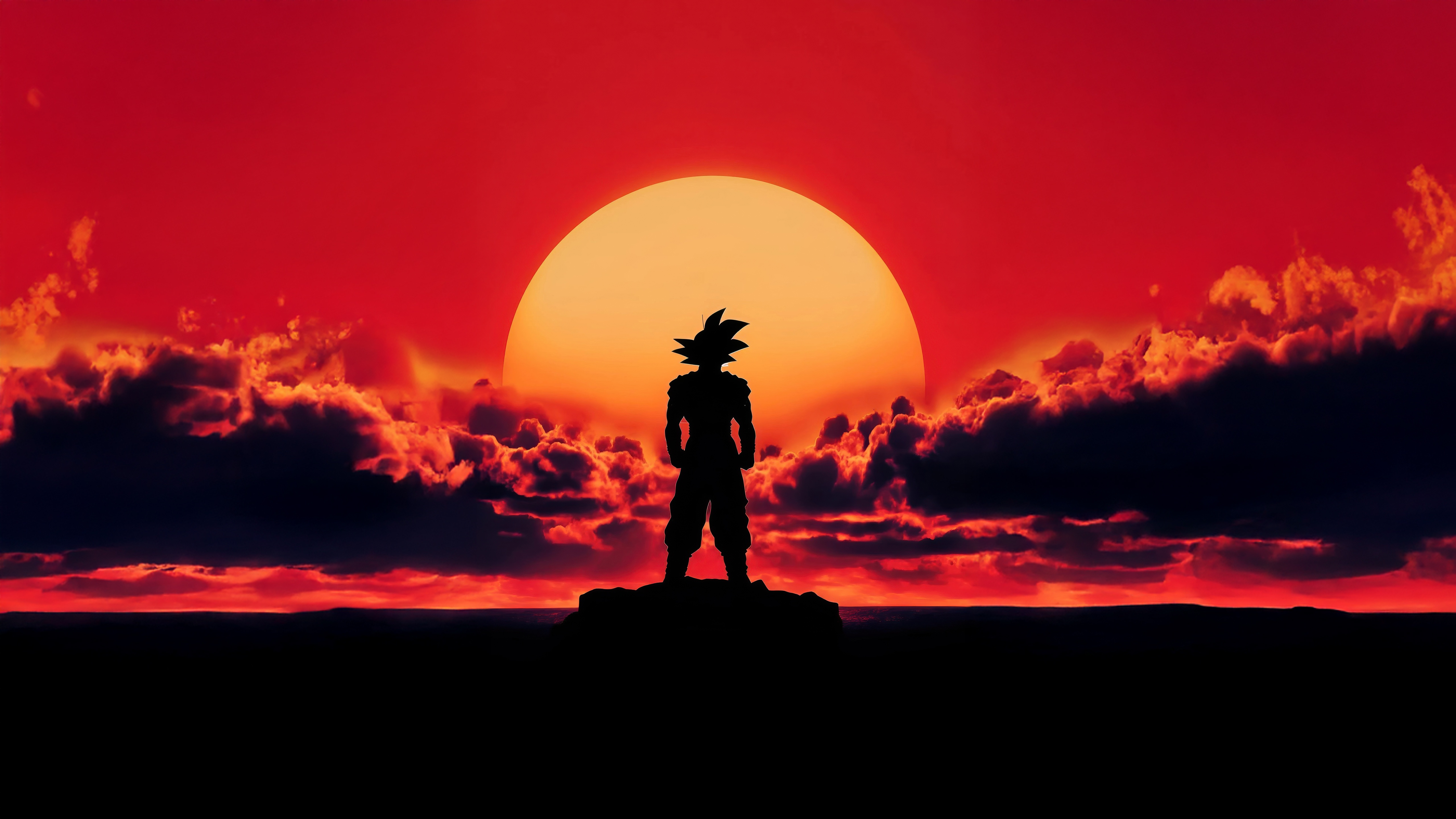 Goku Silhouette Against a Fiery Sunset HD Wallpaper