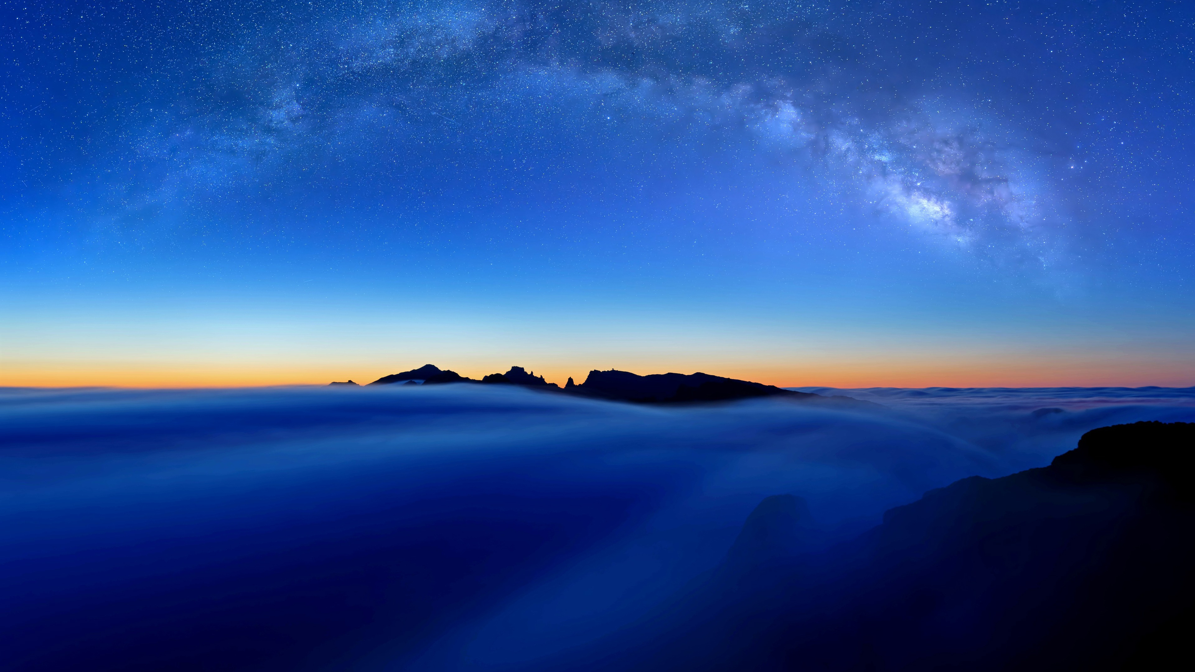 Milky Way over clouds and mountains in Madeira, Portugal HD Wallpaper