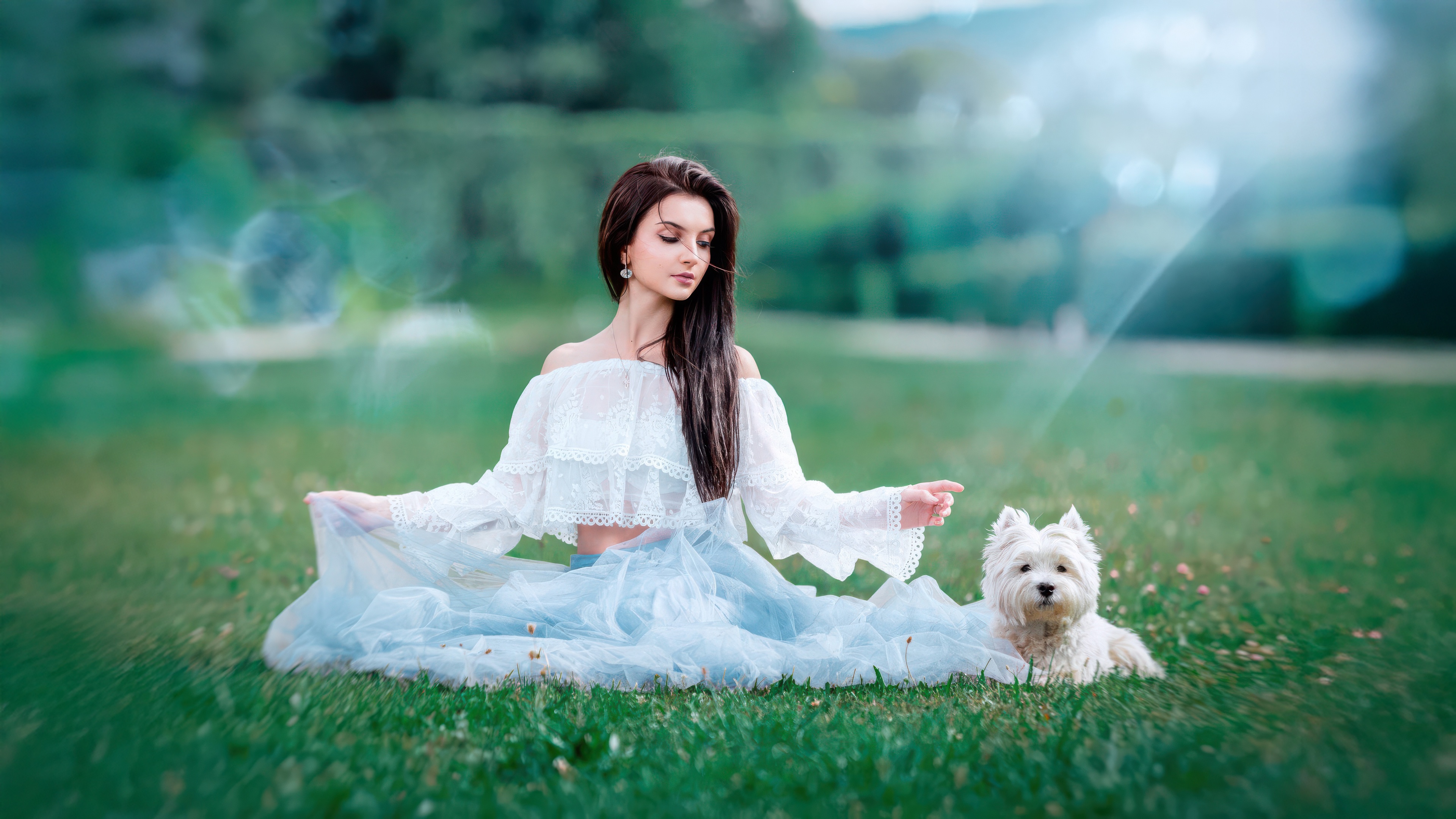 Woman and white dog sitting on grass HD Wallpaper