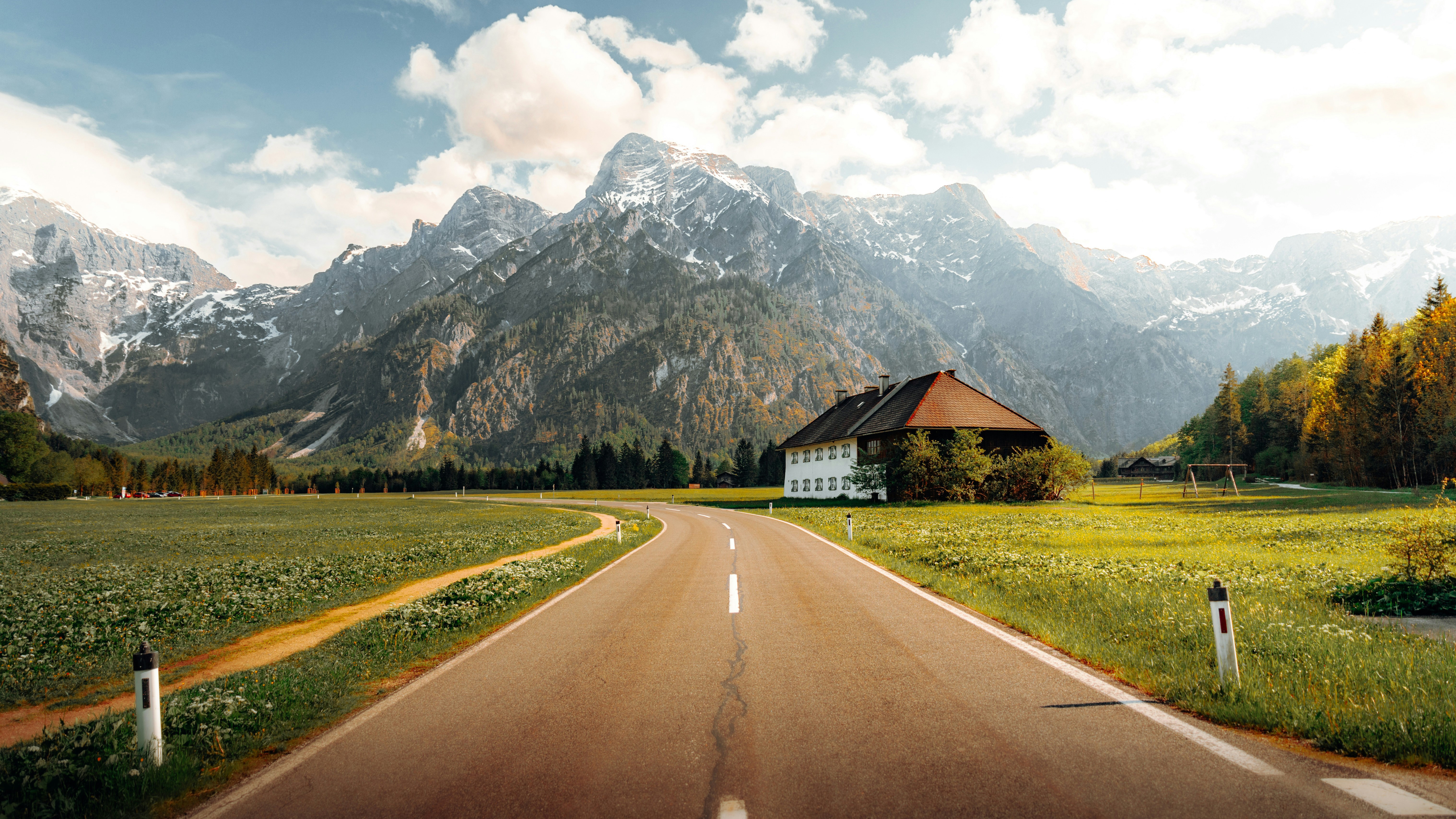 Road to Almsee in Austria with mountains and house HD Wallpaper