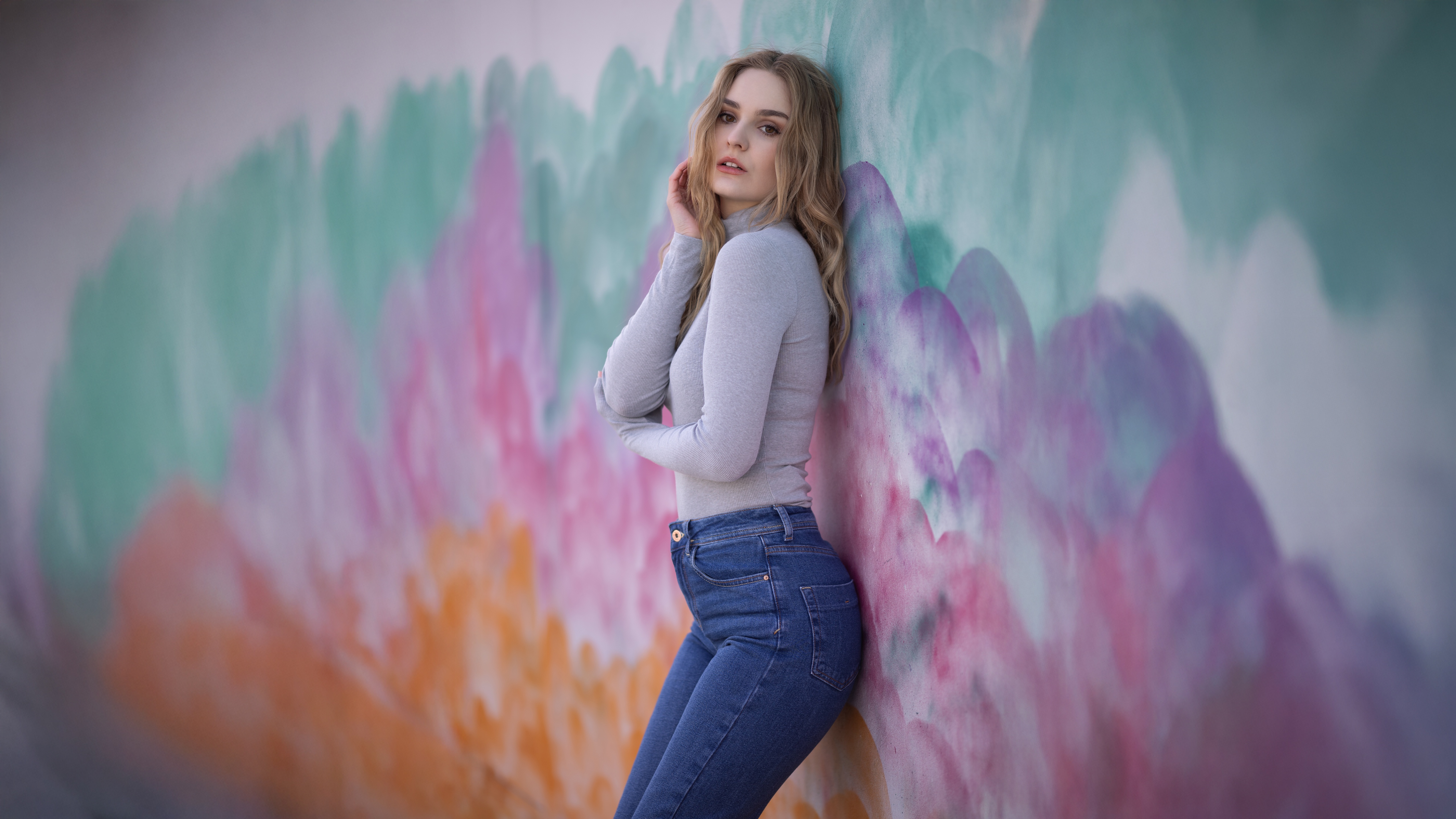 Blonde Model Poses Against a Colorful Mural HD Wallpaper